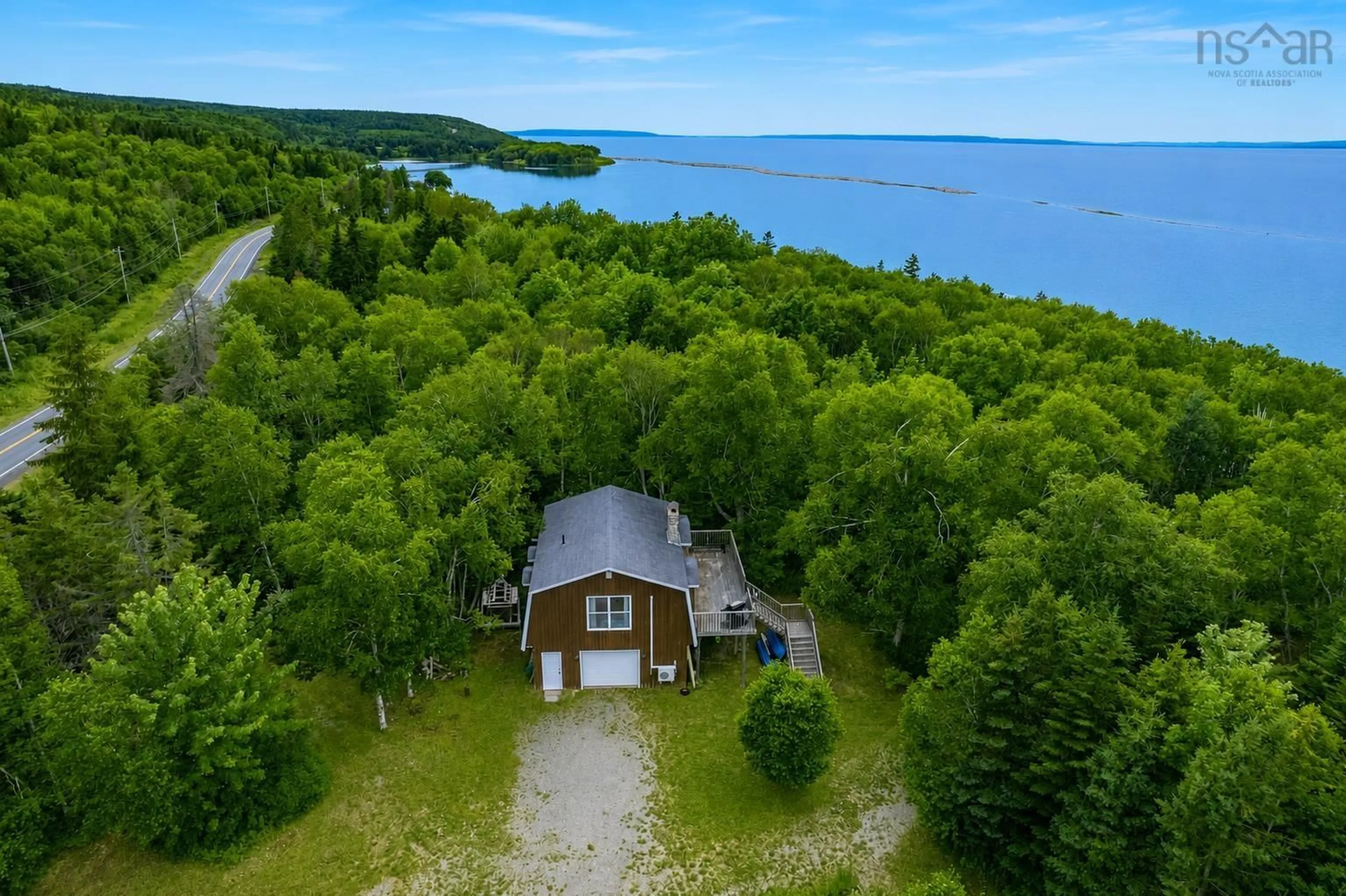 A pic from outside/outdoor area/front of a property/back of a property/a pic from drone, water/lake/river/ocean view for 8456 East Bay Hwy, Big Pond Centre Nova Scotia B1J 1Z6