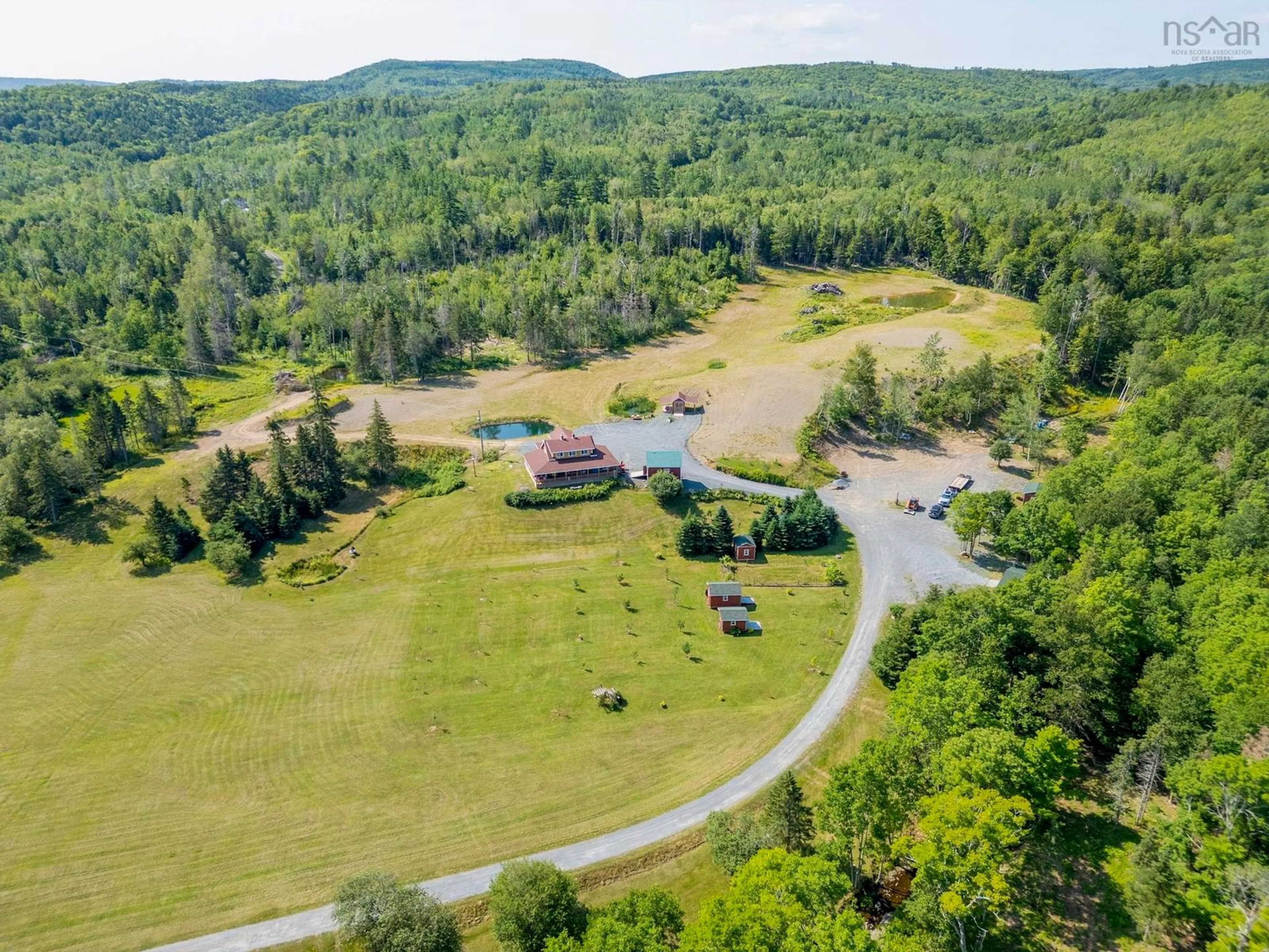 A pic from outside/outdoor area/front of a property/back of a property/a pic from drone, mountain view for 1013 Fall Brook Rd, Mcphersons Mills Nova Scotia B2H 5C8