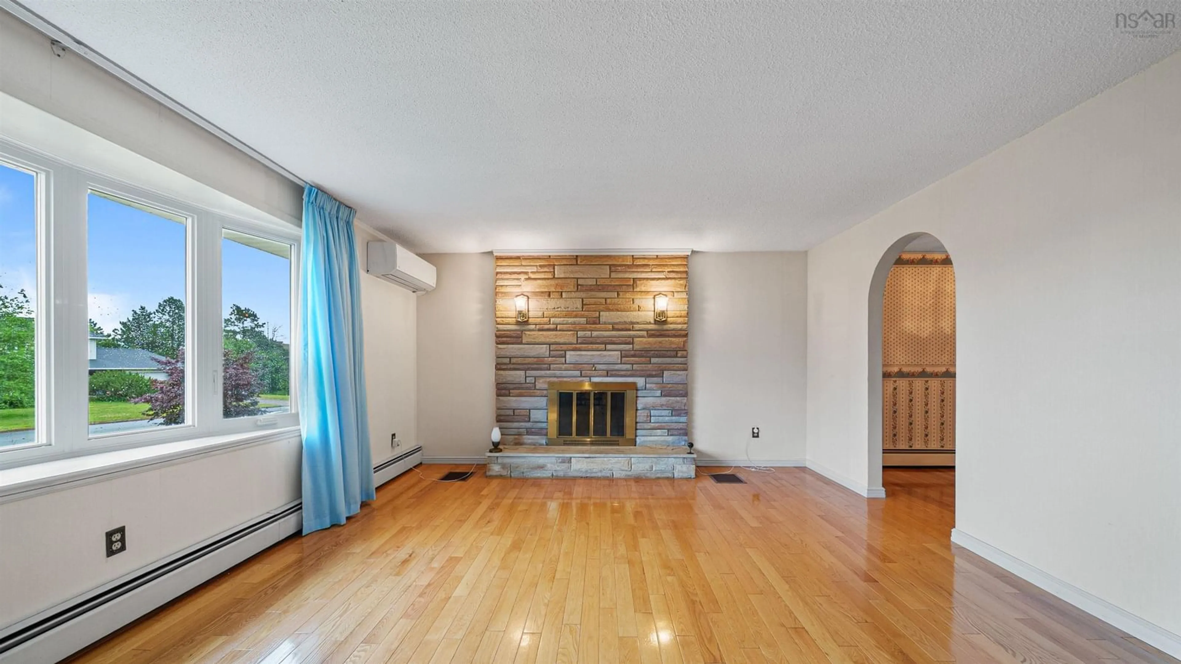 Living room with furniture, wood/laminate floor for 19 Bayswater Rd, Dartmouth Nova Scotia B2W 4H2