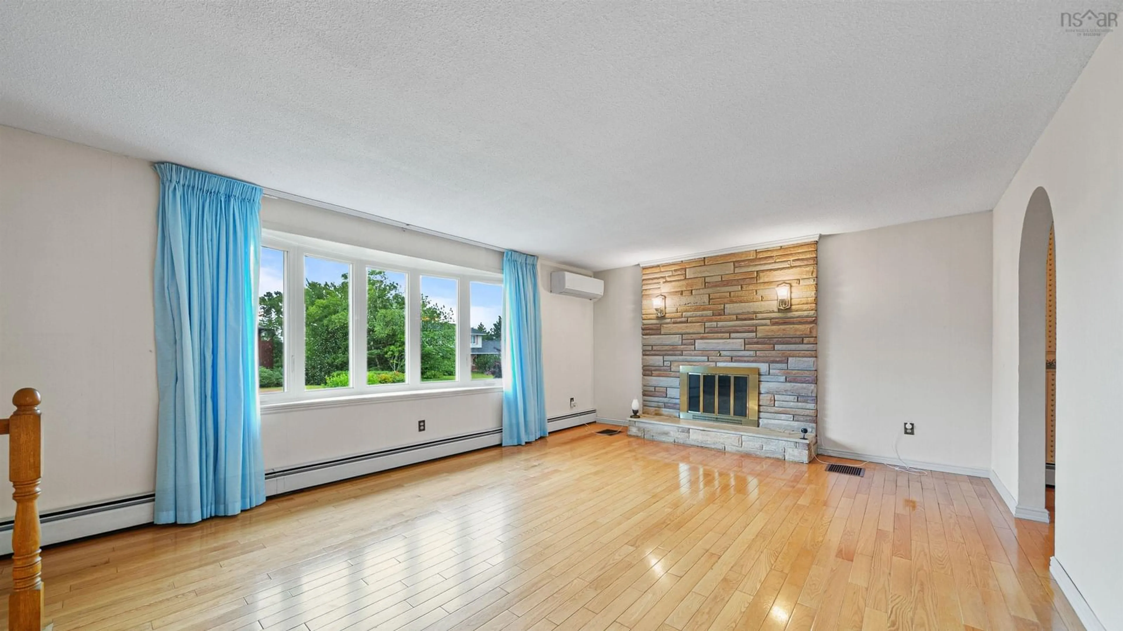 Living room with furniture, wood/laminate floor for 19 Bayswater Rd, Dartmouth Nova Scotia B2W 4H2