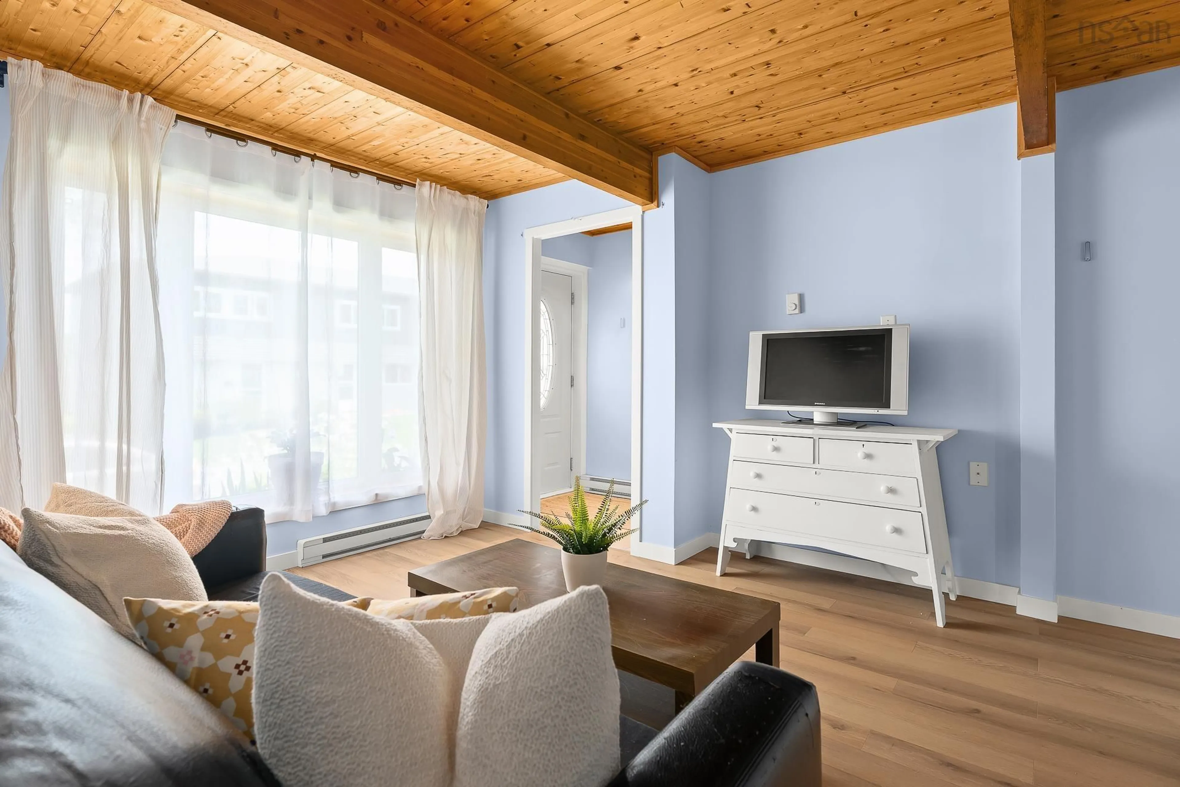 Living room with furniture, wood/laminate floor for 104 Bromley Rd, Halifax Nova Scotia B3P 2L7