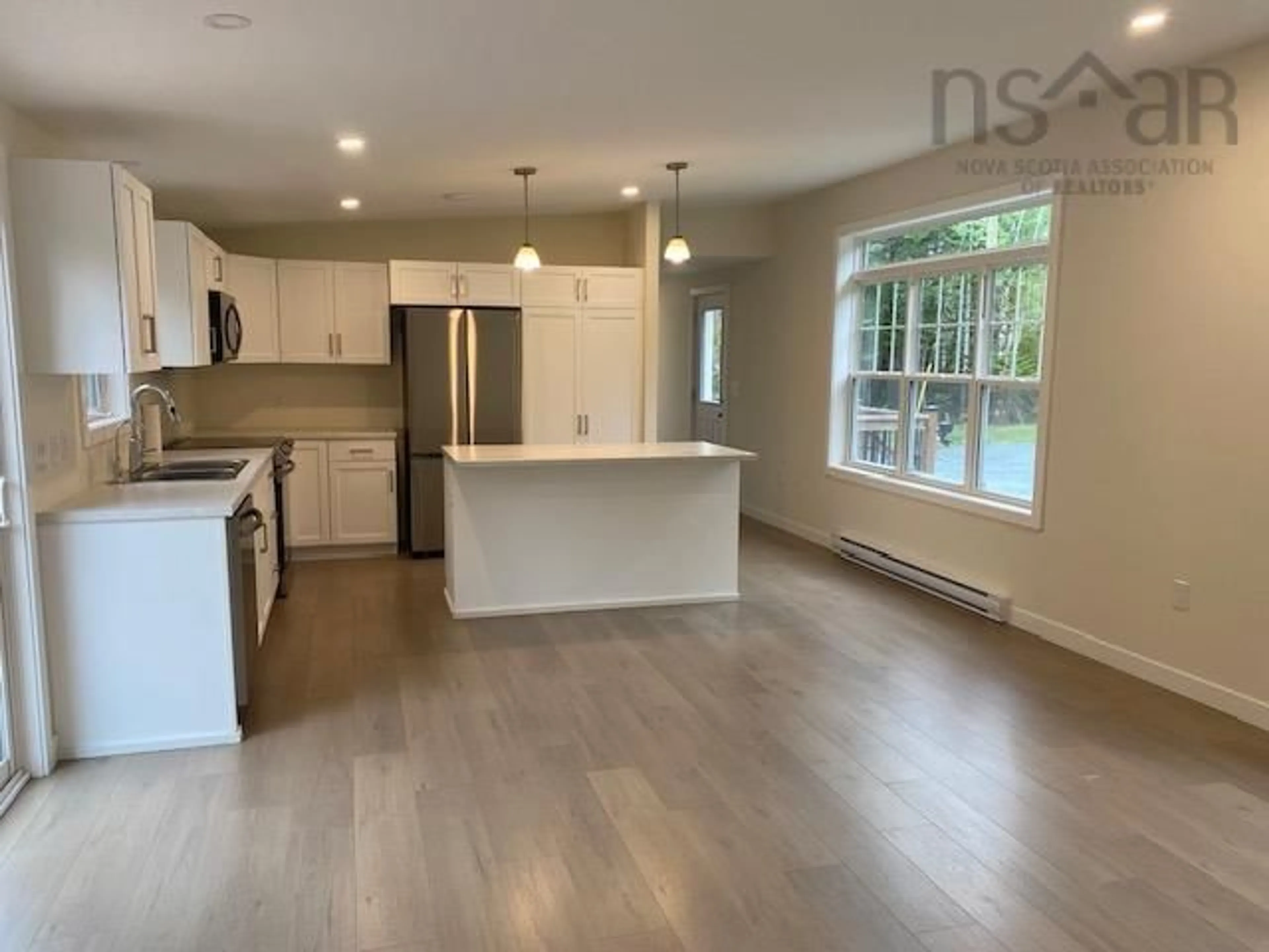 Open concept kitchen, wood/laminate floor for 1134 Lake Egmont Rd, Lake Egmont Nova Scotia B0N 1Y0