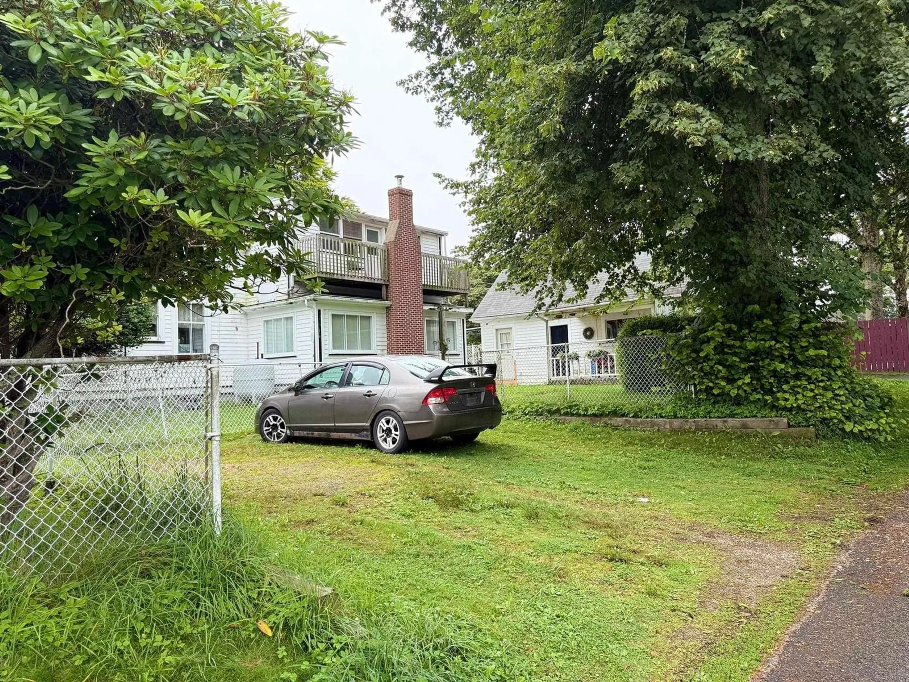 A pic from outside/outdoor area/front of a property/back of a property/a pic from drone, street for 55 Forest St, Yarmouth Nova Scotia B5A 3L7