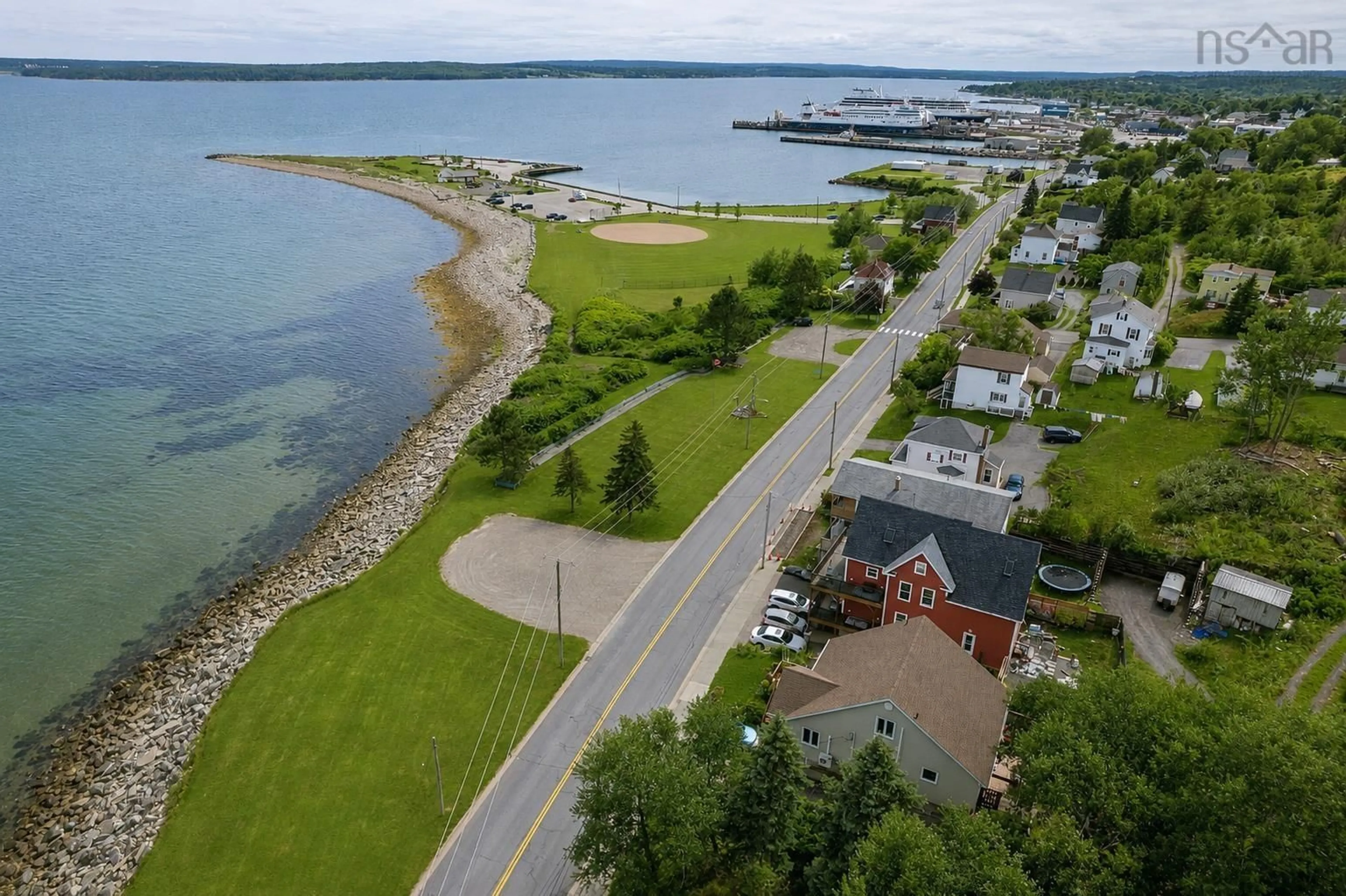 A pic from outside/outdoor area/front of a property/back of a property/a pic from drone, water/lake/river/ocean view for 488 Purves St, North Sydney Nova Scotia B2A 1E1
