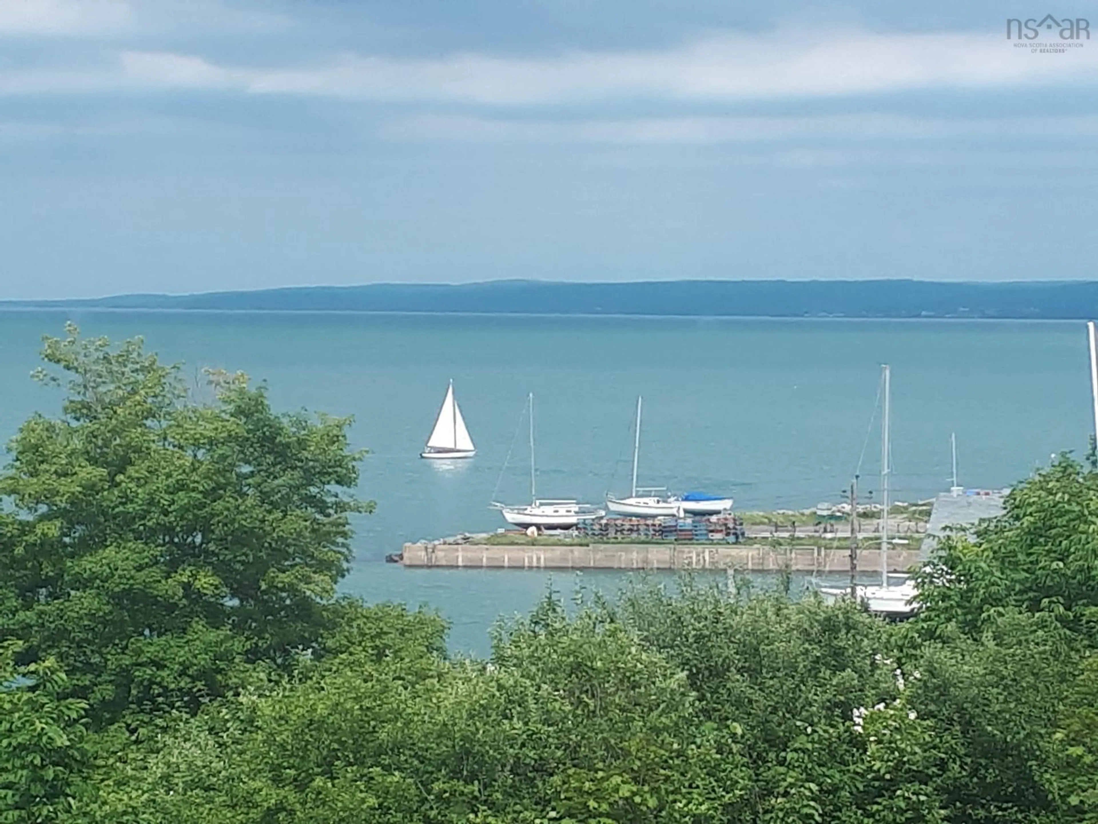 A pic from outside/outdoor area/front of a property/back of a property/a pic from drone, water/lake/river/ocean view for 210 King St, Digby Nova Scotia B0V 1A0