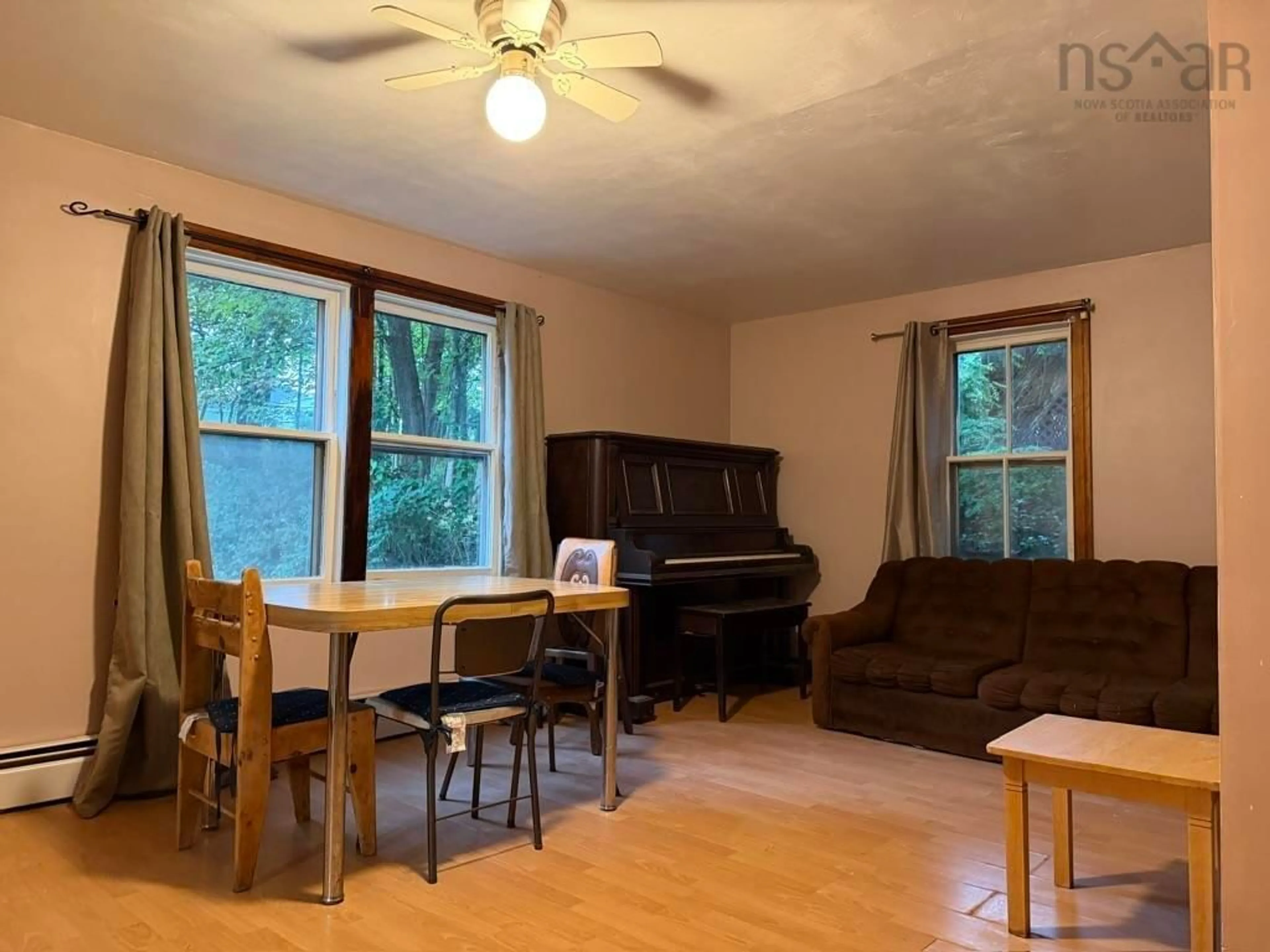 Living room with furniture, wood/laminate floor for 17 Mechanic St, Trenton Nova Scotia B0K 1X2