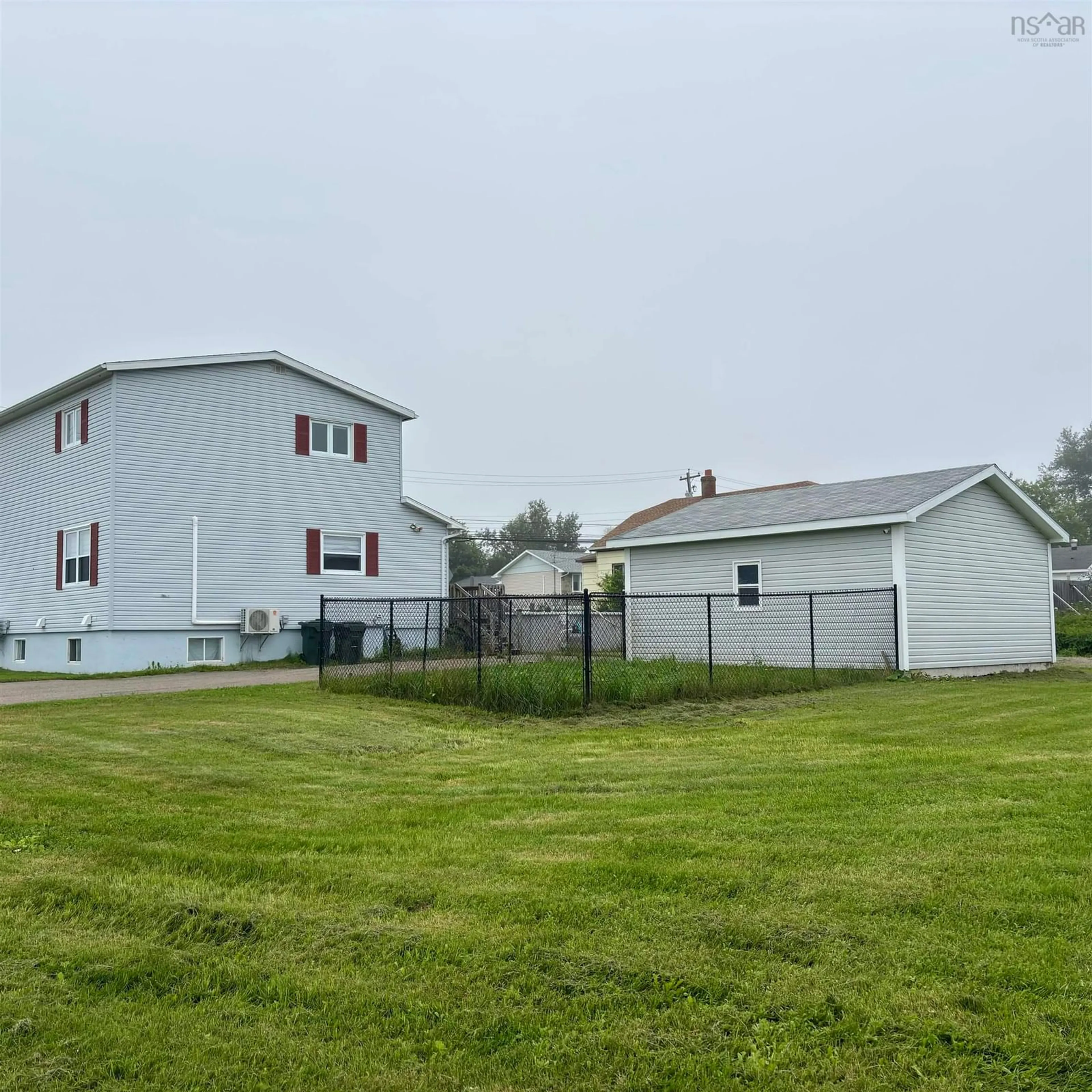 A pic from outside/outdoor area/front of a property/back of a property/a pic from drone, unknown for 683 Mahon St, New Waterford Nova Scotia B1H 3K6