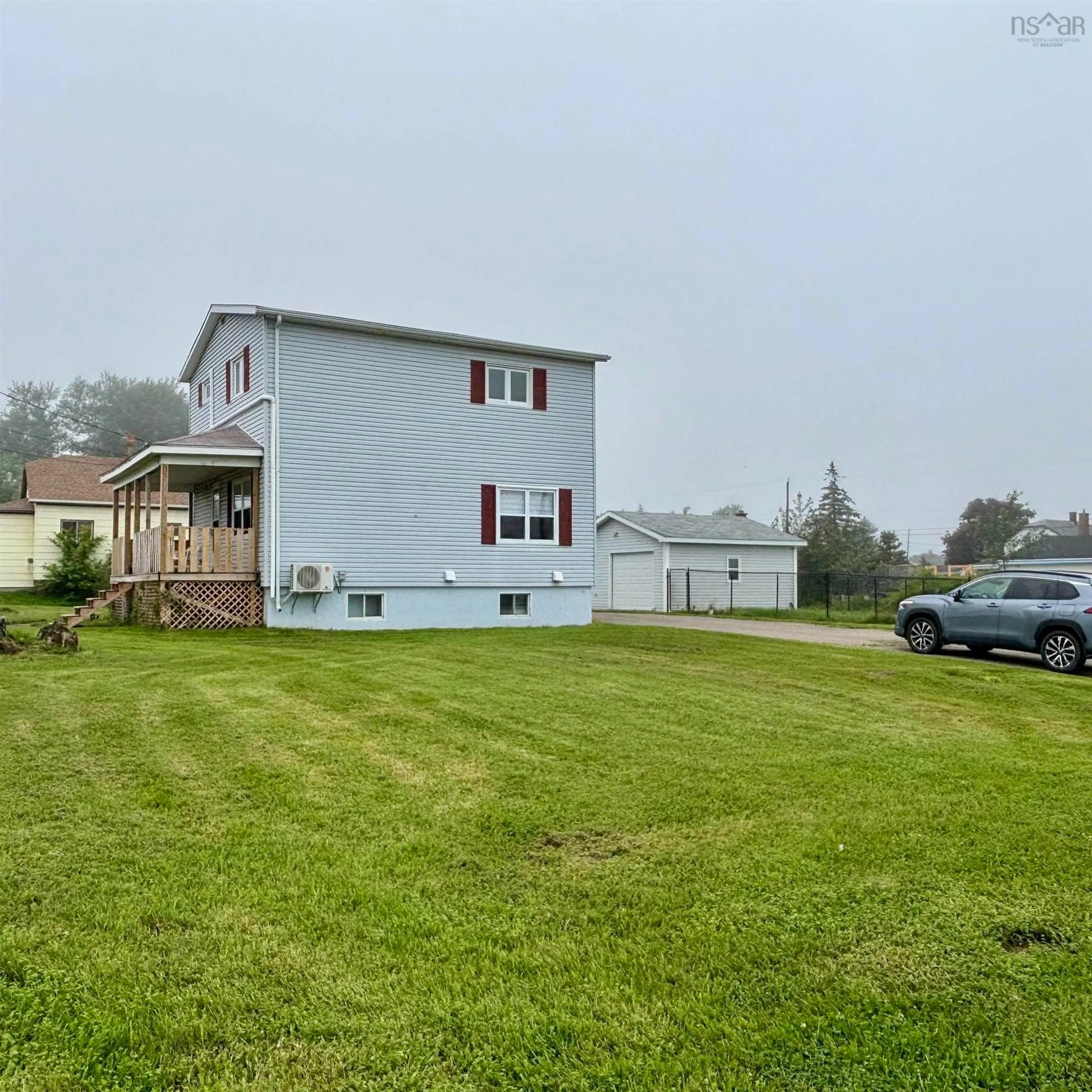 A pic from outside/outdoor area/front of a property/back of a property/a pic from drone, water/lake/river/ocean view for 683 Mahon St, New Waterford Nova Scotia B1H 3K6
