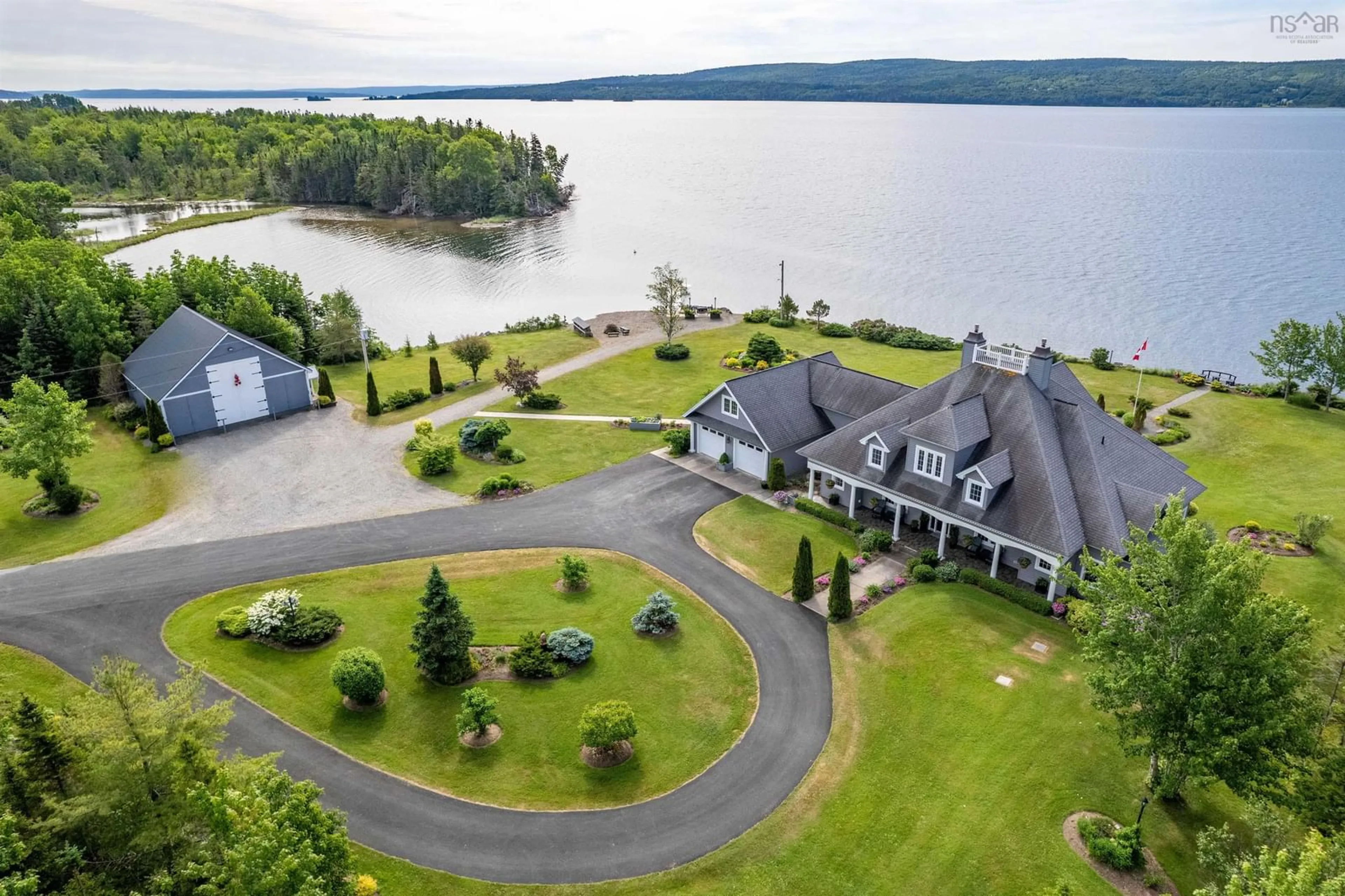 A pic from outside/outdoor area/front of a property/back of a property/a pic from drone, water/lake/river/ocean view for 8805 Highway 105 Baddeck Inlet, Baddeck Inlet Nova Scotia B0E 1B0