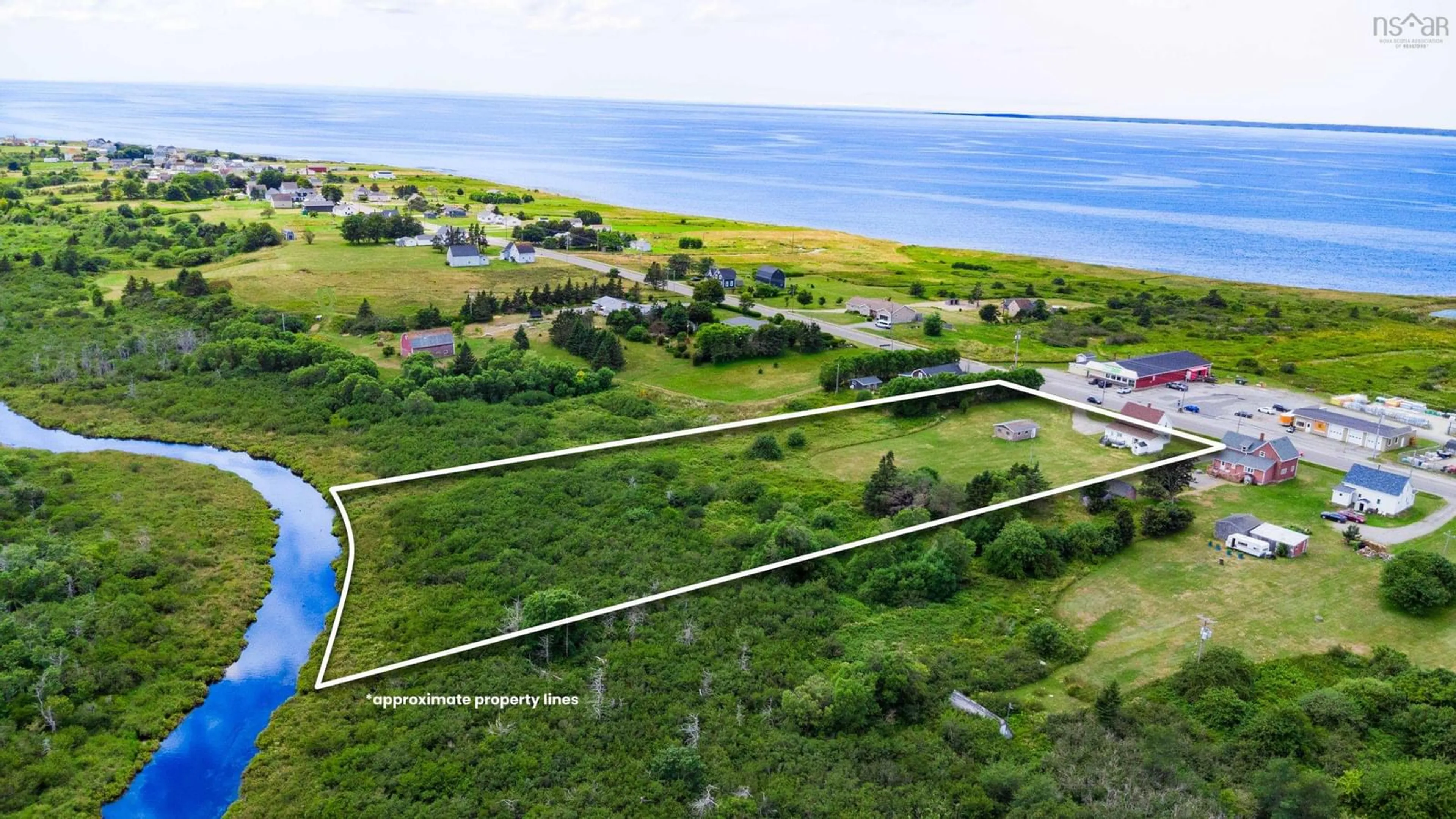 A pic from outside/outdoor area/front of a property/back of a property/a pic from drone, water/lake/river/ocean view for 650 Highway 1, Comeauville Nova Scotia B0W 1Z0