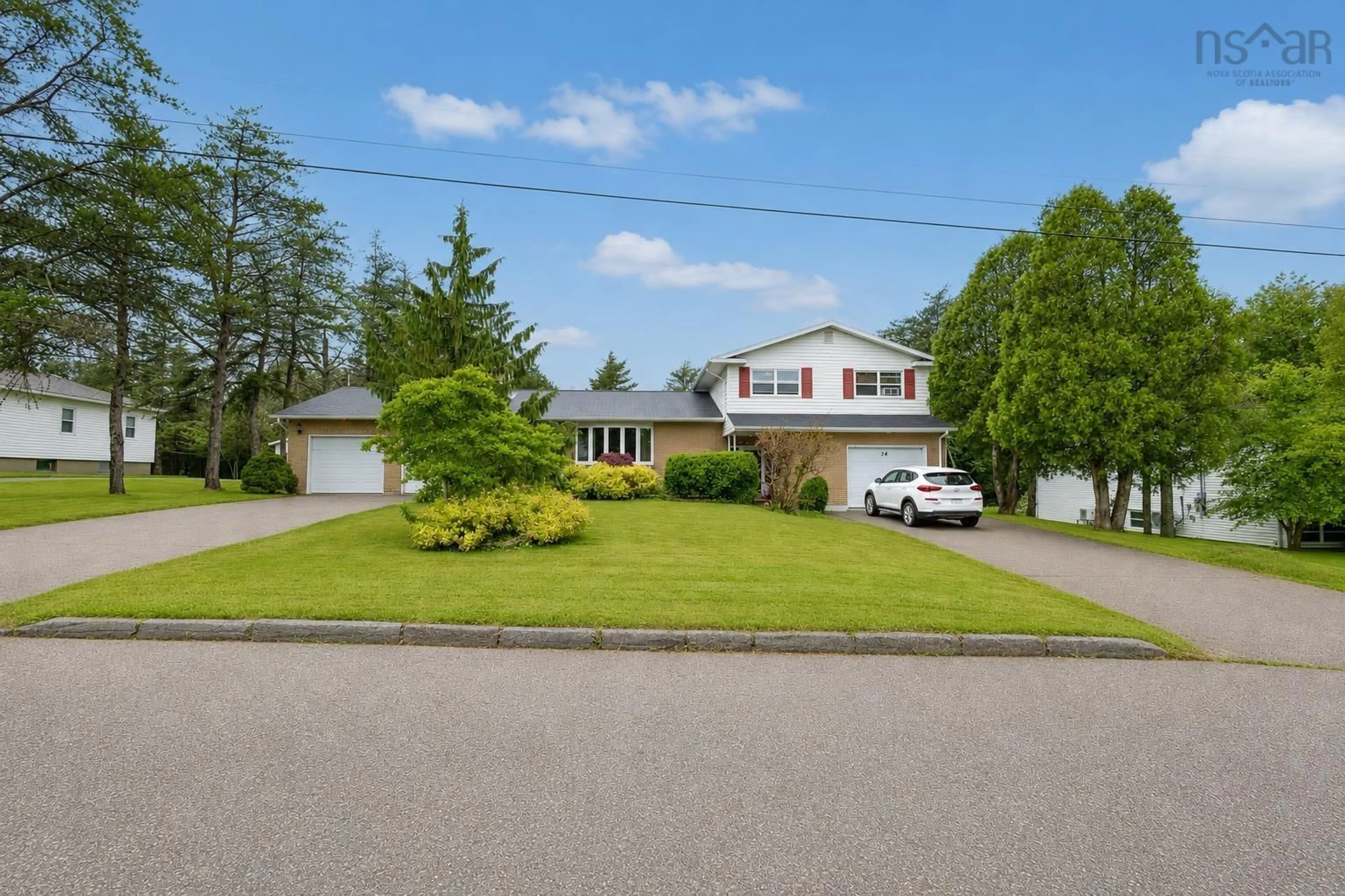A pic from outside/outdoor area/front of a property/back of a property/a pic from drone, street for 34 Macdougall Hts, Sydney River Nova Scotia B1S 3A7