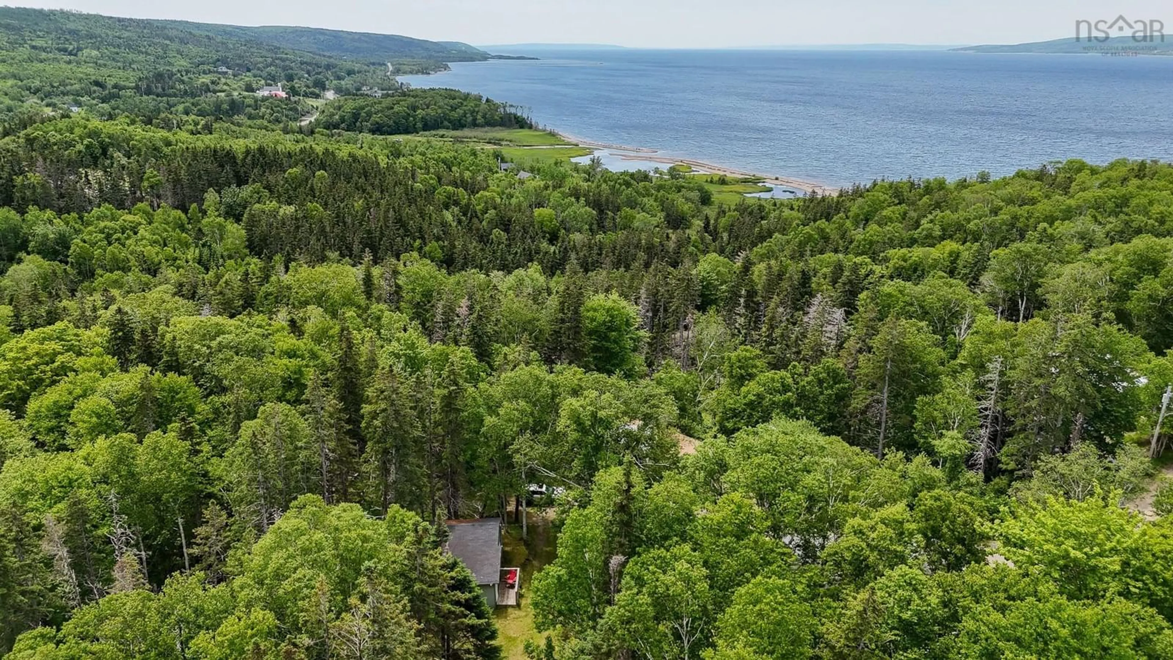 A pic from outside/outdoor area/front of a property/back of a property/a pic from drone, water/lake/river/ocean view for 47 Claymore Lane, Big Pond Nova Scotia B1J 1S7