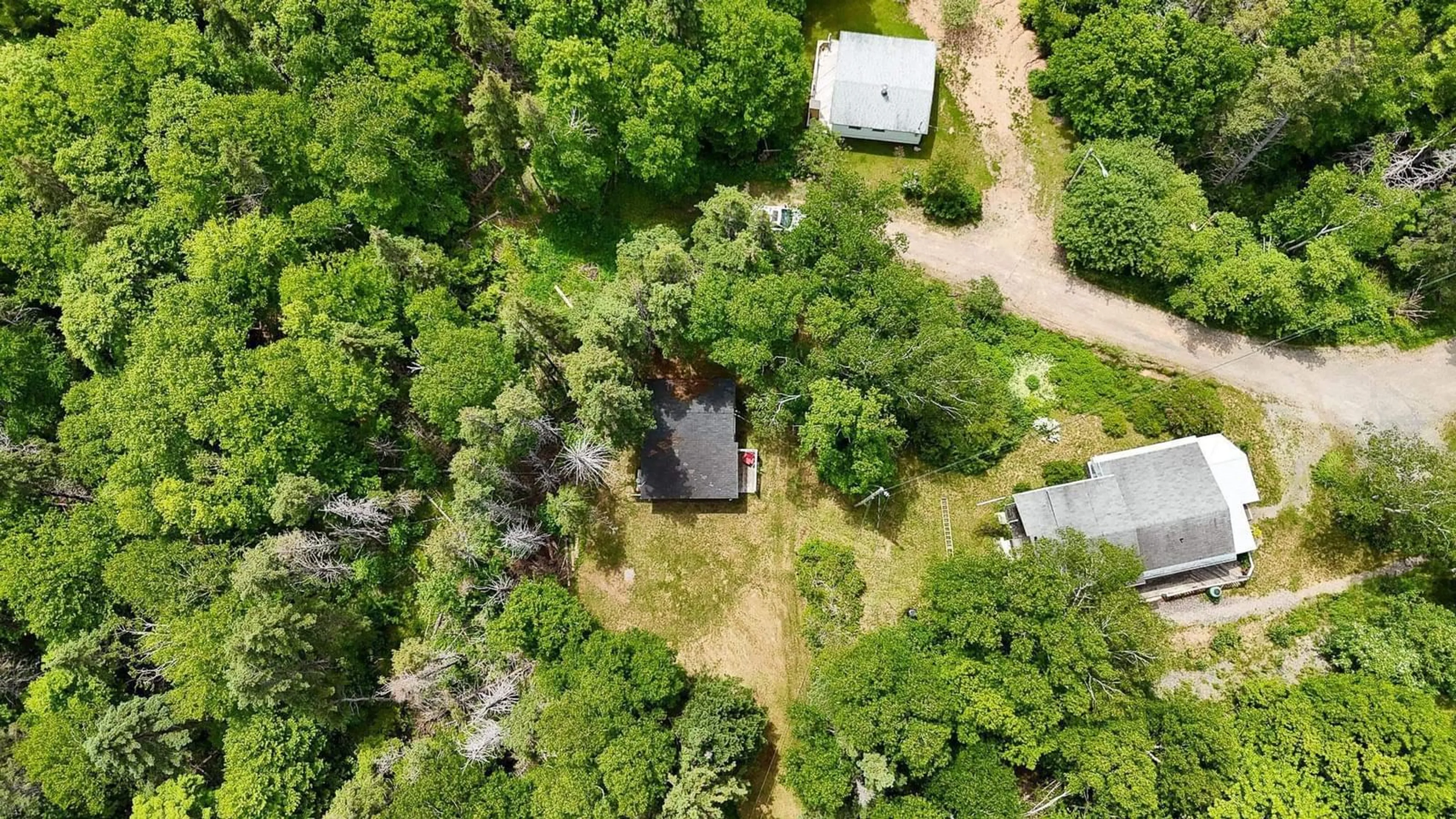 A pic from outside/outdoor area/front of a property/back of a property/a pic from drone, forest/trees view for 47 Claymore Lane, Big Pond Nova Scotia B1J 1S7