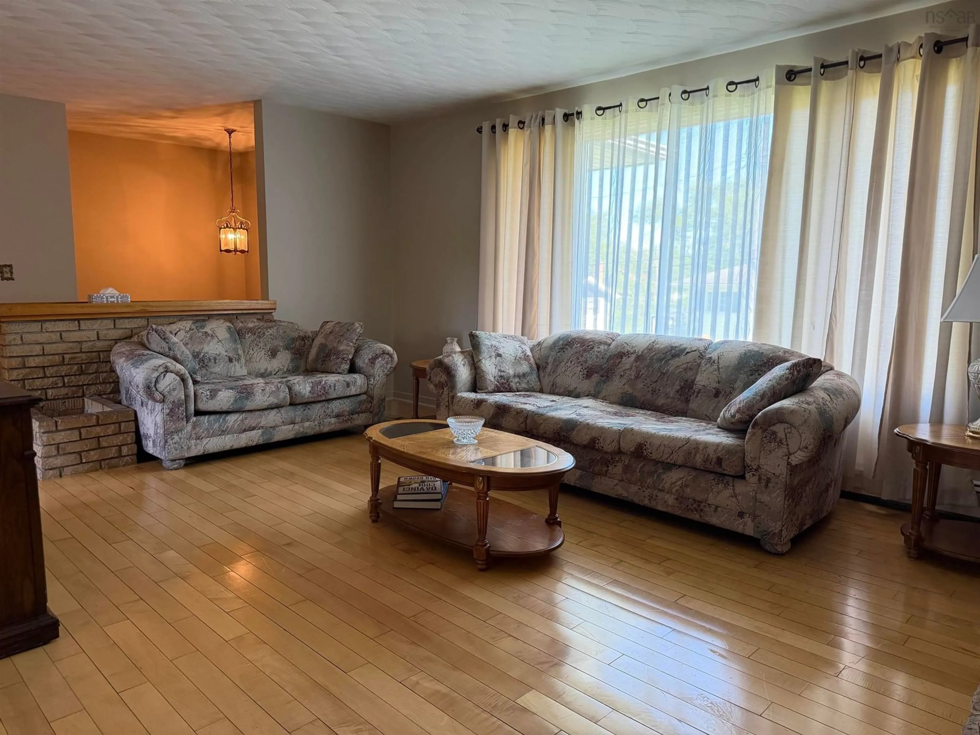 Living room with furniture, wood/laminate floor for 2 Edina St, Glace Bay Nova Scotia B1A 1G7