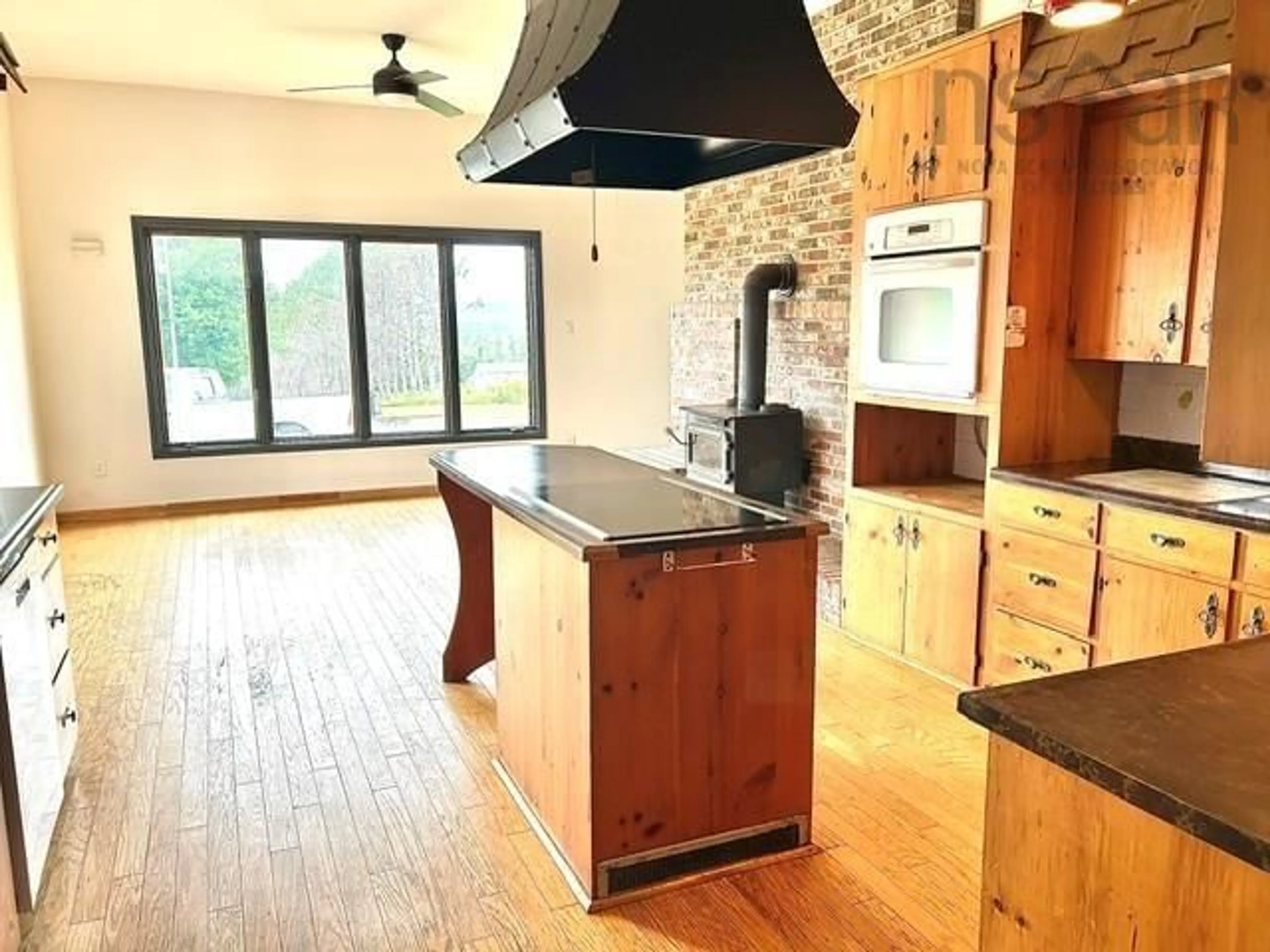 Open concept kitchen, wood/laminate floor for 903 Pictou Rd, East Mountain Nova Scotia B6L 2N1