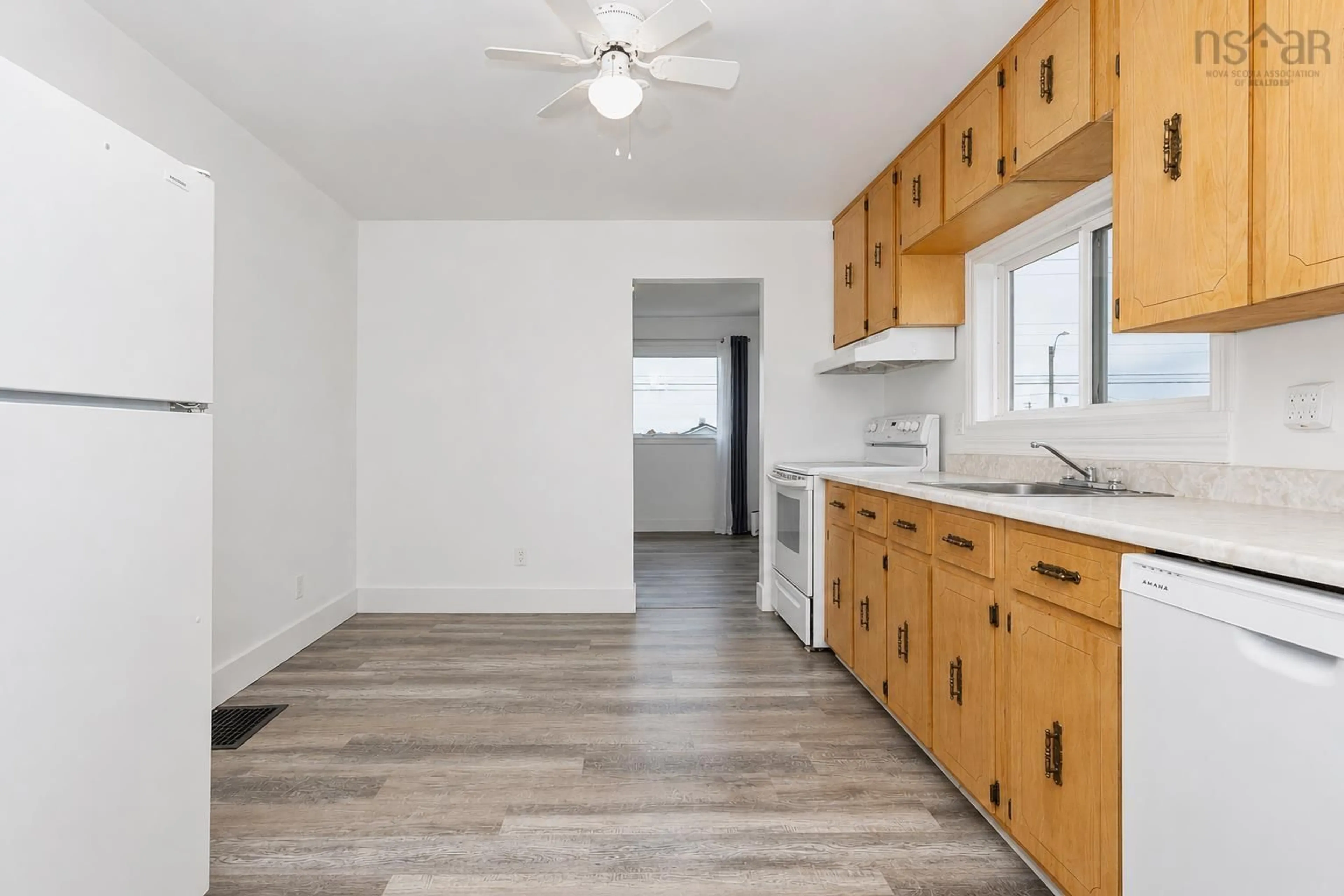 Standard kitchen, wood/laminate floor for 3444 Emerald St, New Waterford Nova Scotia B1H 1H6
