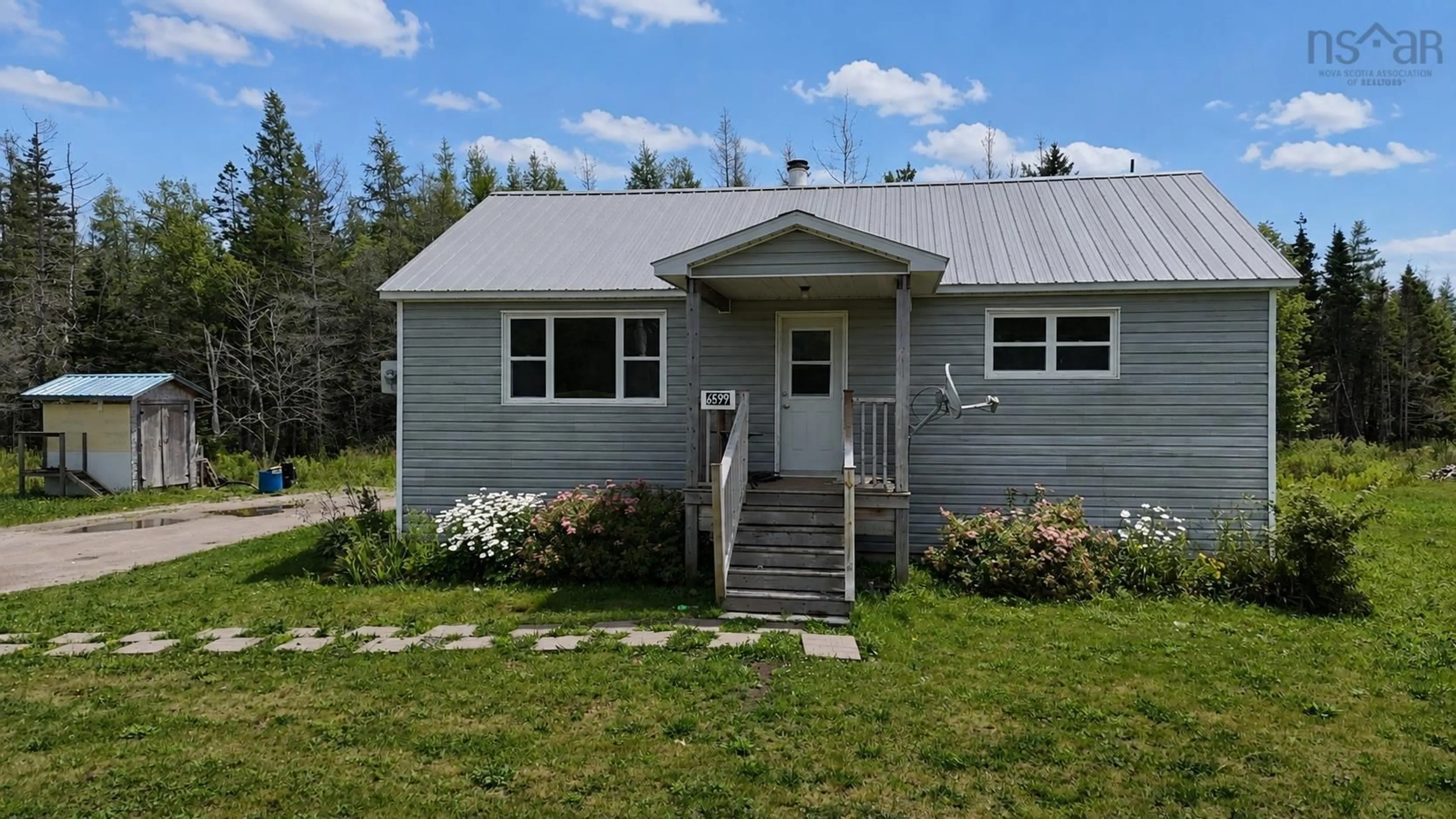 Home with vinyl exterior material, building for 6599 Cabot Trail, North East Margaree Nova Scotia B0E 2H0