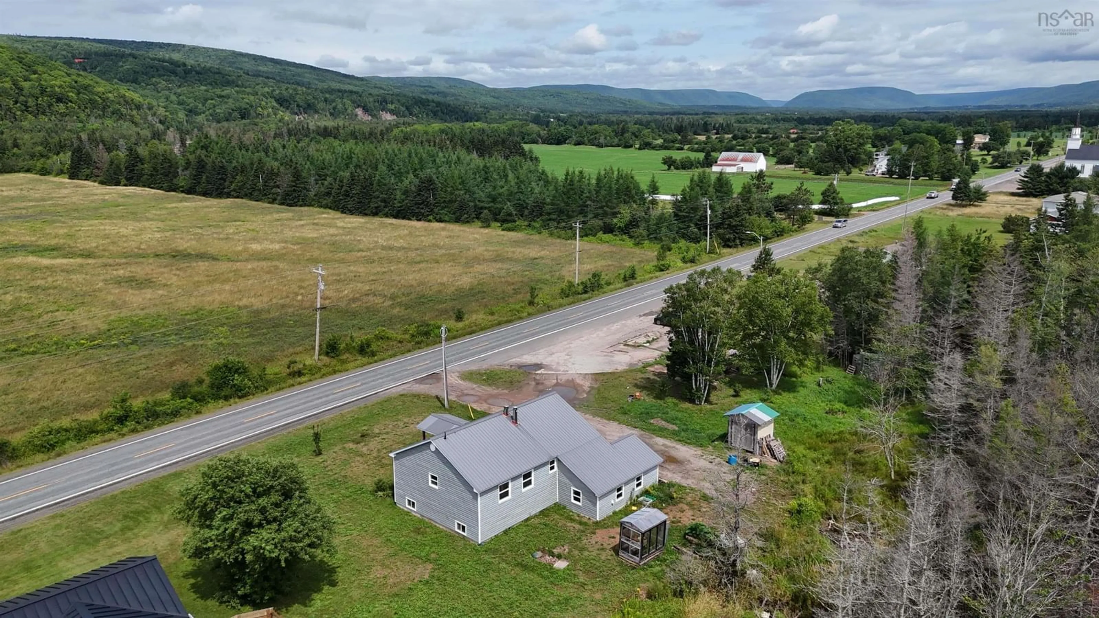 A pic from outside/outdoor area/front of a property/back of a property/a pic from drone, mountain view for 6599 Cabot Trail, North East Margaree Nova Scotia B0E 2H0