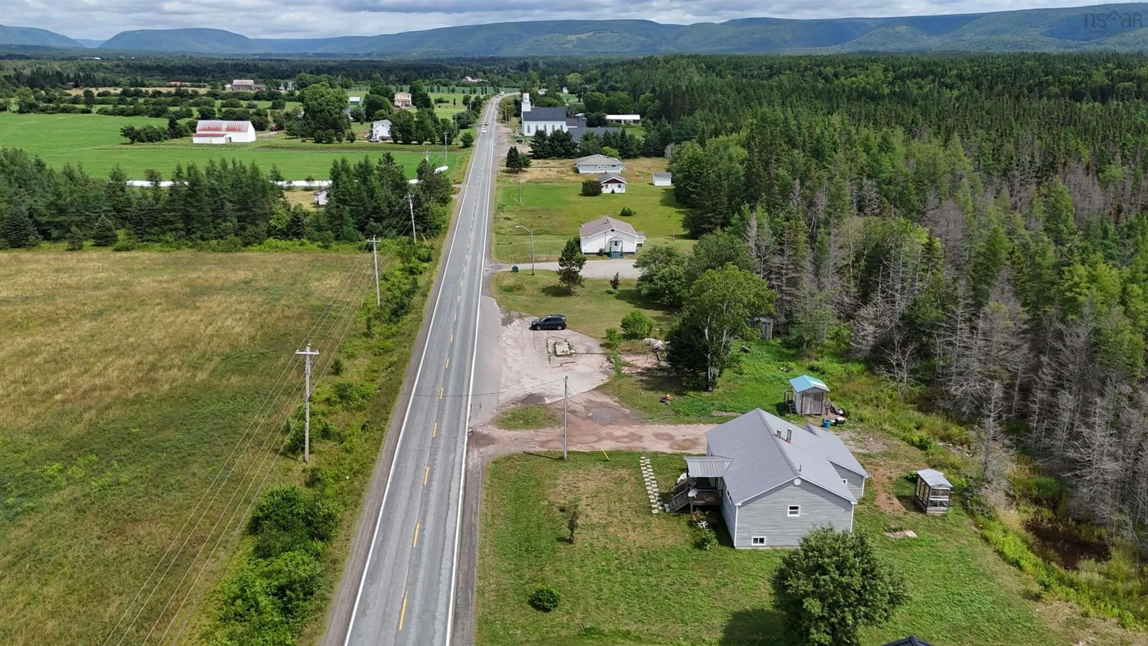 A pic from outside/outdoor area/front of a property/back of a property/a pic from drone, street for 6599 Cabot Trail, North East Margaree Nova Scotia B0E 2H0