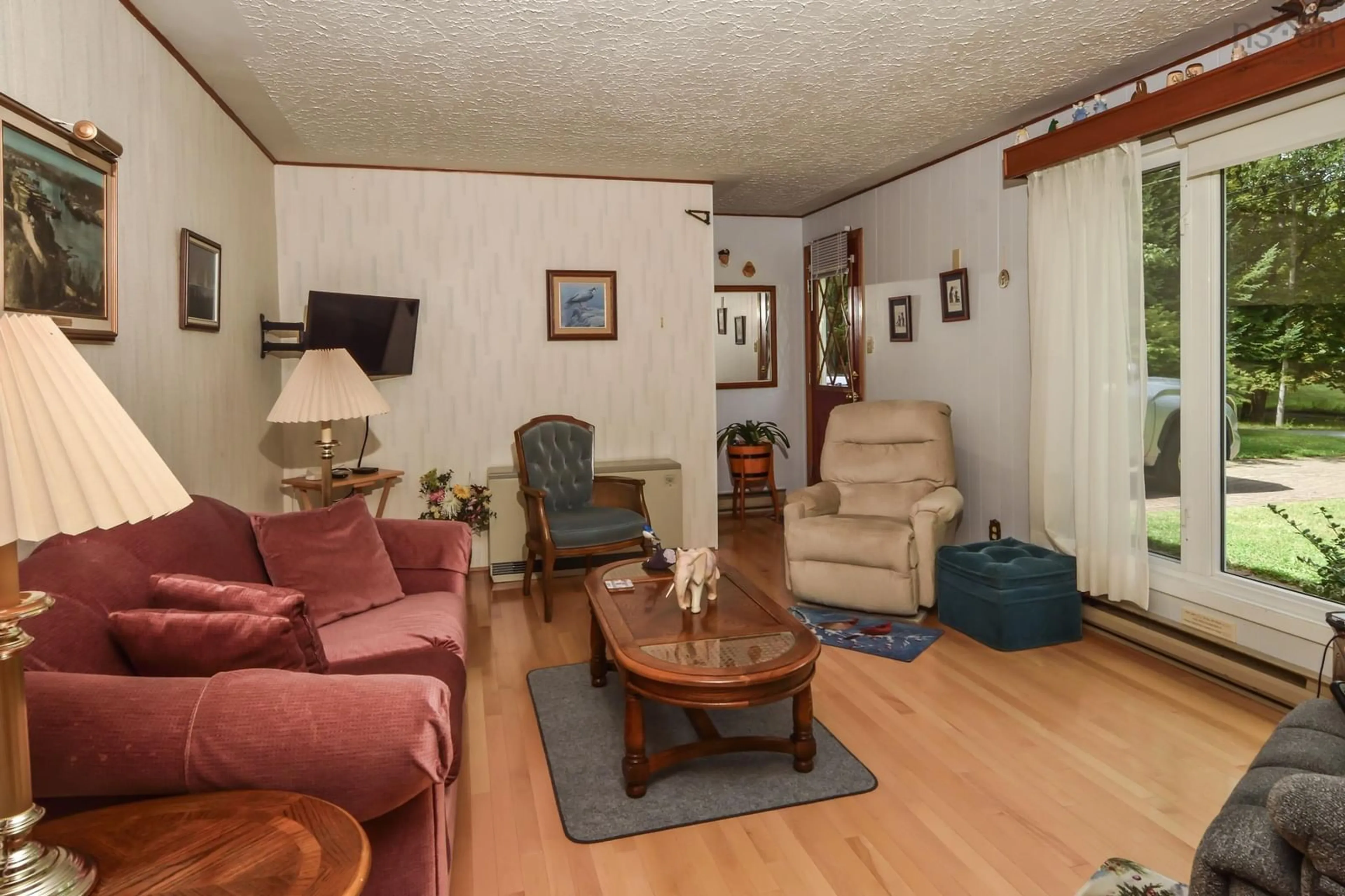 Living room with furniture, wood/laminate floor for 24 Green Acres Rd, Pleasantville Nova Scotia B0R 1G0