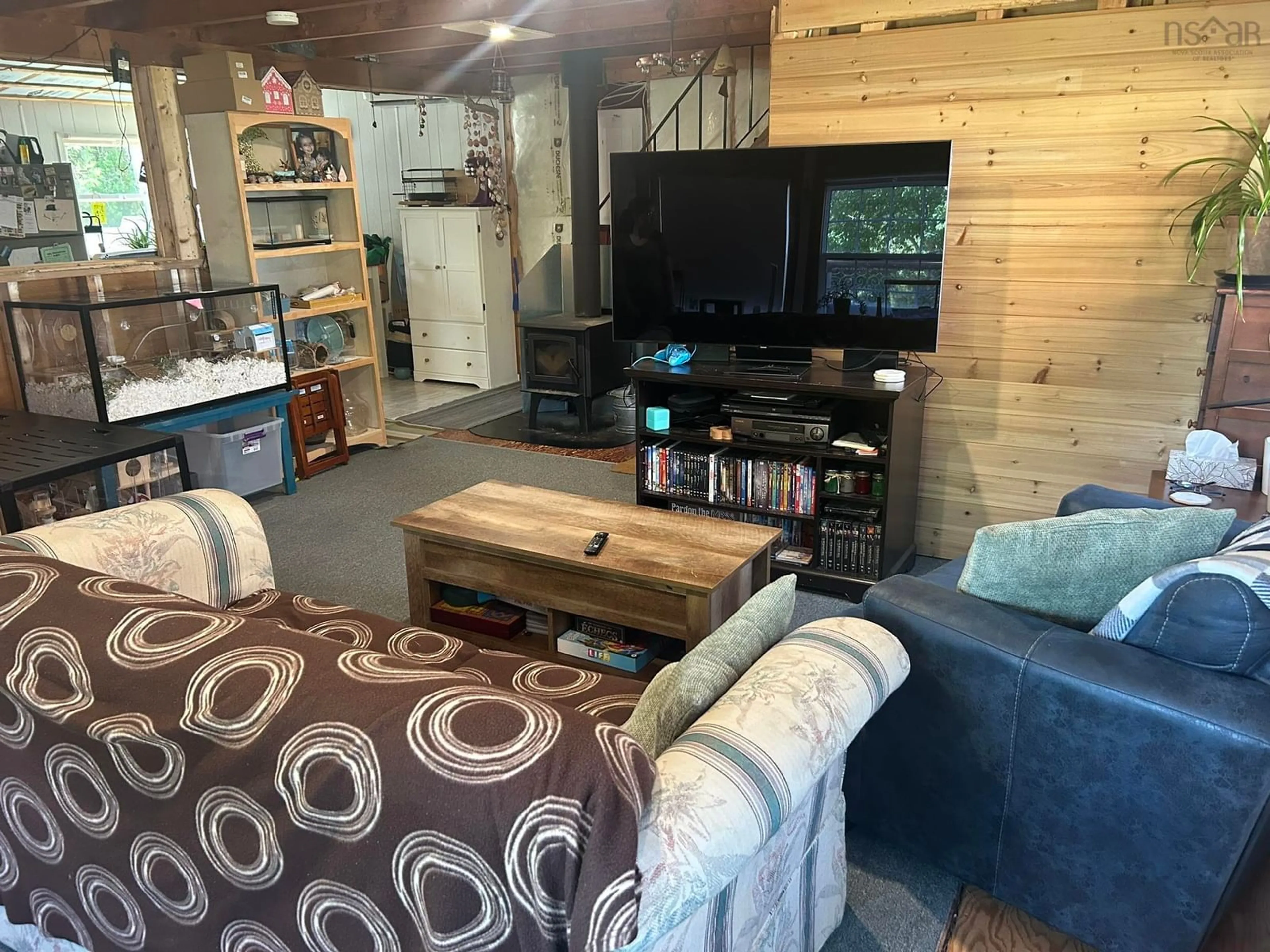 Living room with furniture, wood/laminate floor for 92 Coldspring Head Rd, Amherst Shore Nova Scotia B0L 1E0