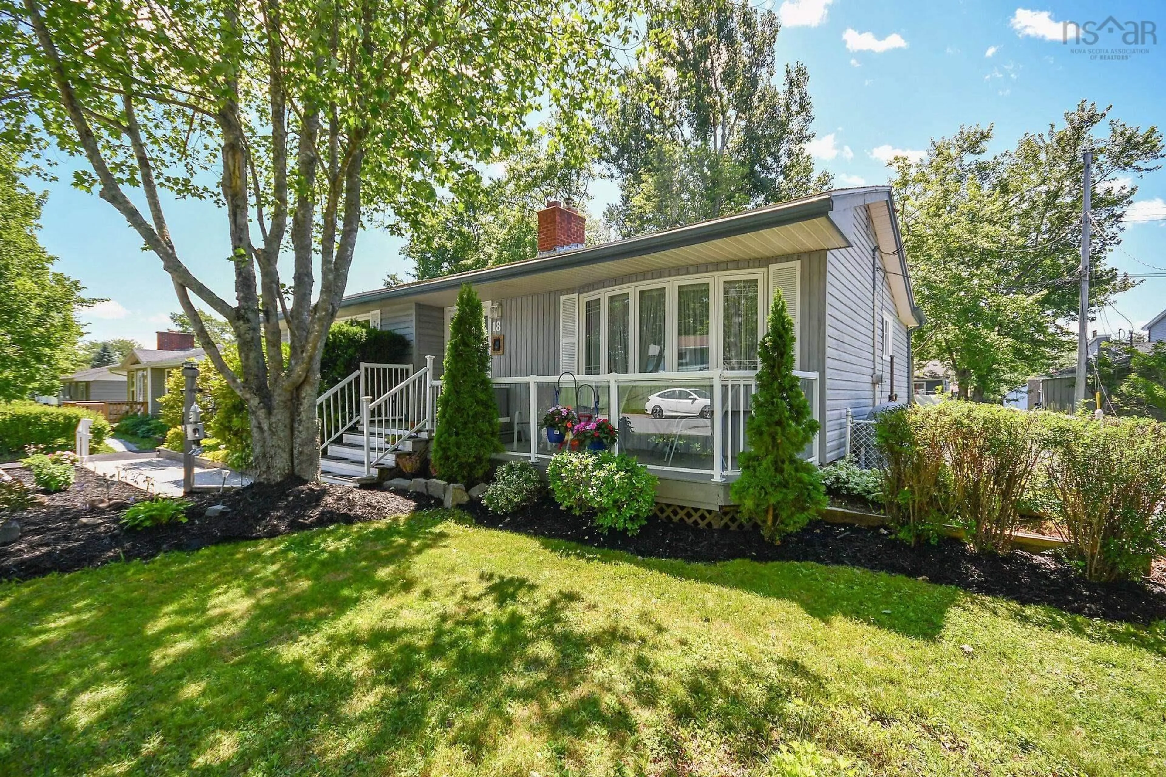 Home with vinyl exterior material, street for 18 Beaumont Dr, Lower Sackville Nova Scotia B4C 1V6