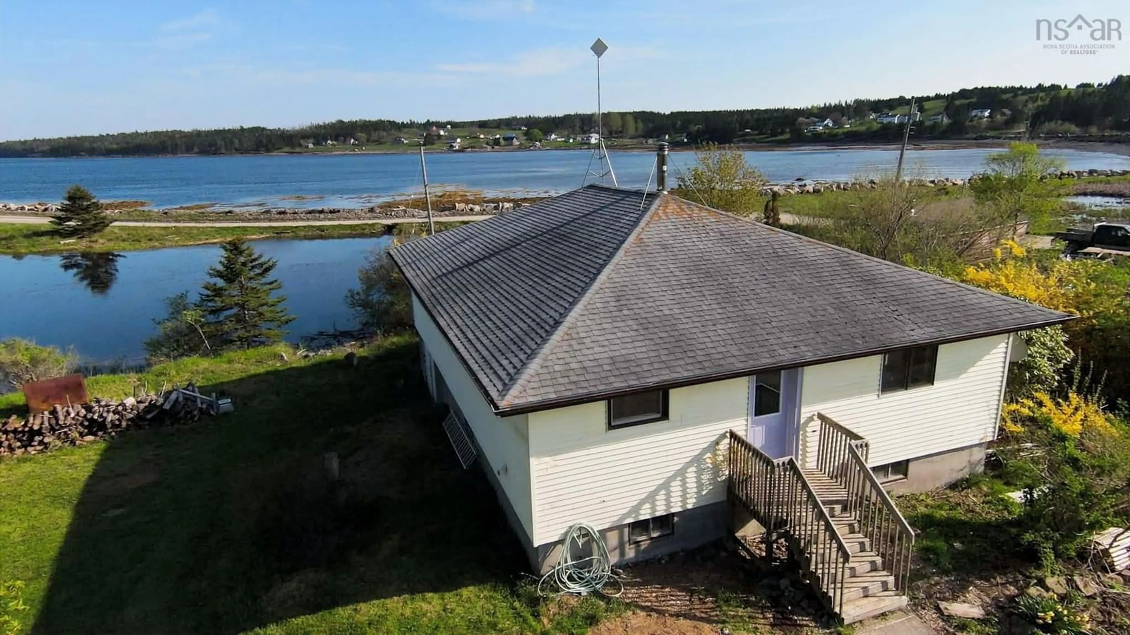 A pic from outside/outdoor area/front of a property/back of a property/a pic from drone, water/lake/river/ocean view for 149 South East Cove Rd, Big Tancook Island Nova Scotia B0J 3G0