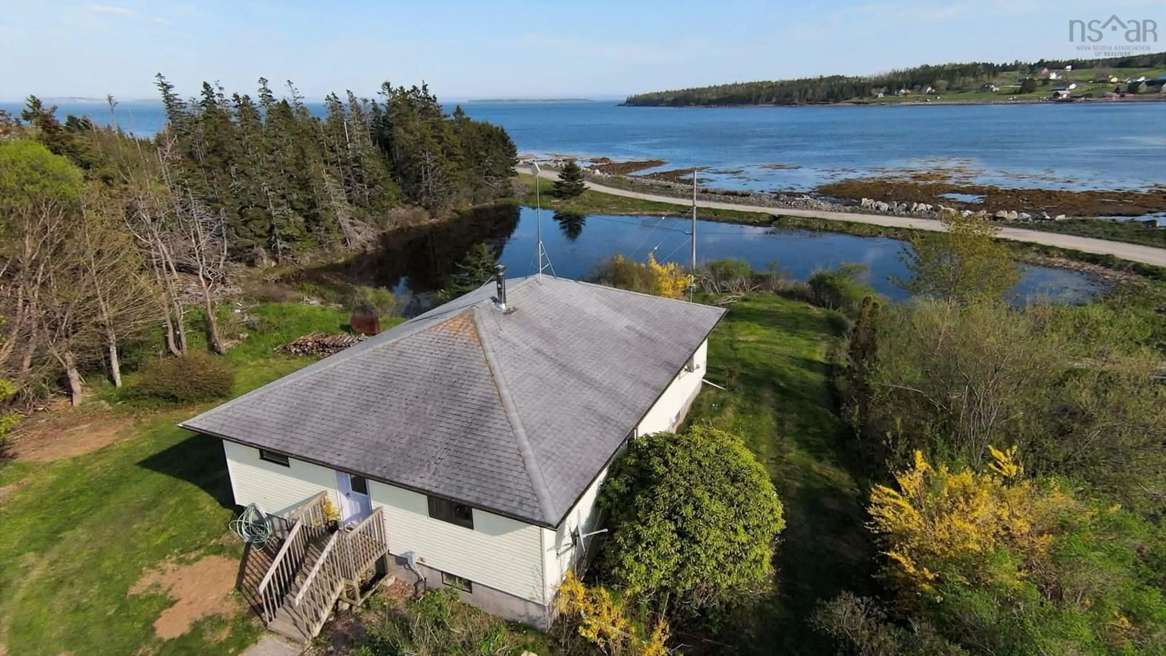 A pic from outside/outdoor area/front of a property/back of a property/a pic from drone, water/lake/river/ocean view for 149 South East Cove Rd, Big Tancook Island Nova Scotia B0J 3G0