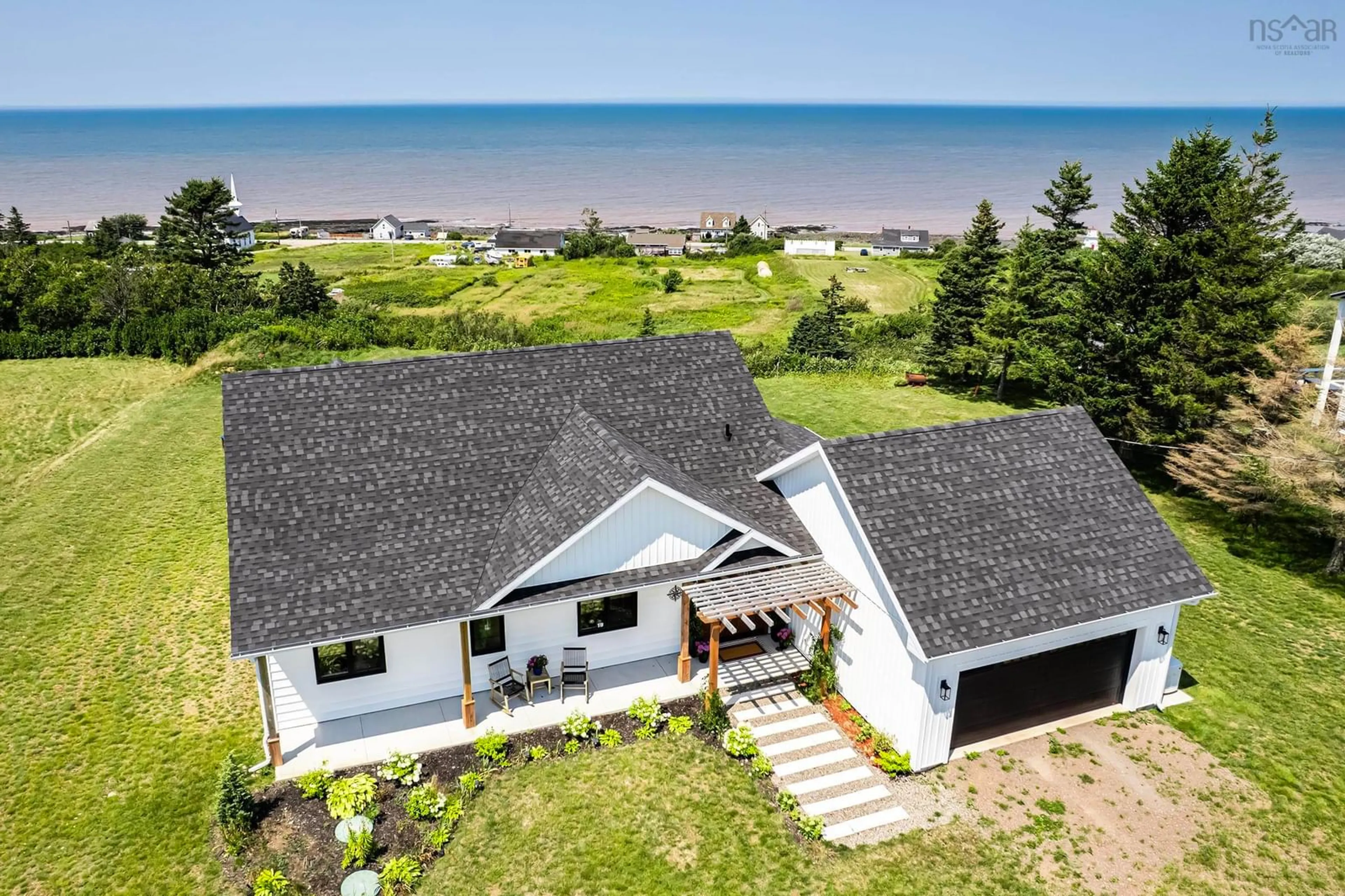 A pic from outside/outdoor area/front of a property/back of a property/a pic from drone, water/lake/river/ocean view for 19 Mcinnis Rd, Port George Nova Scotia B0S 1P0