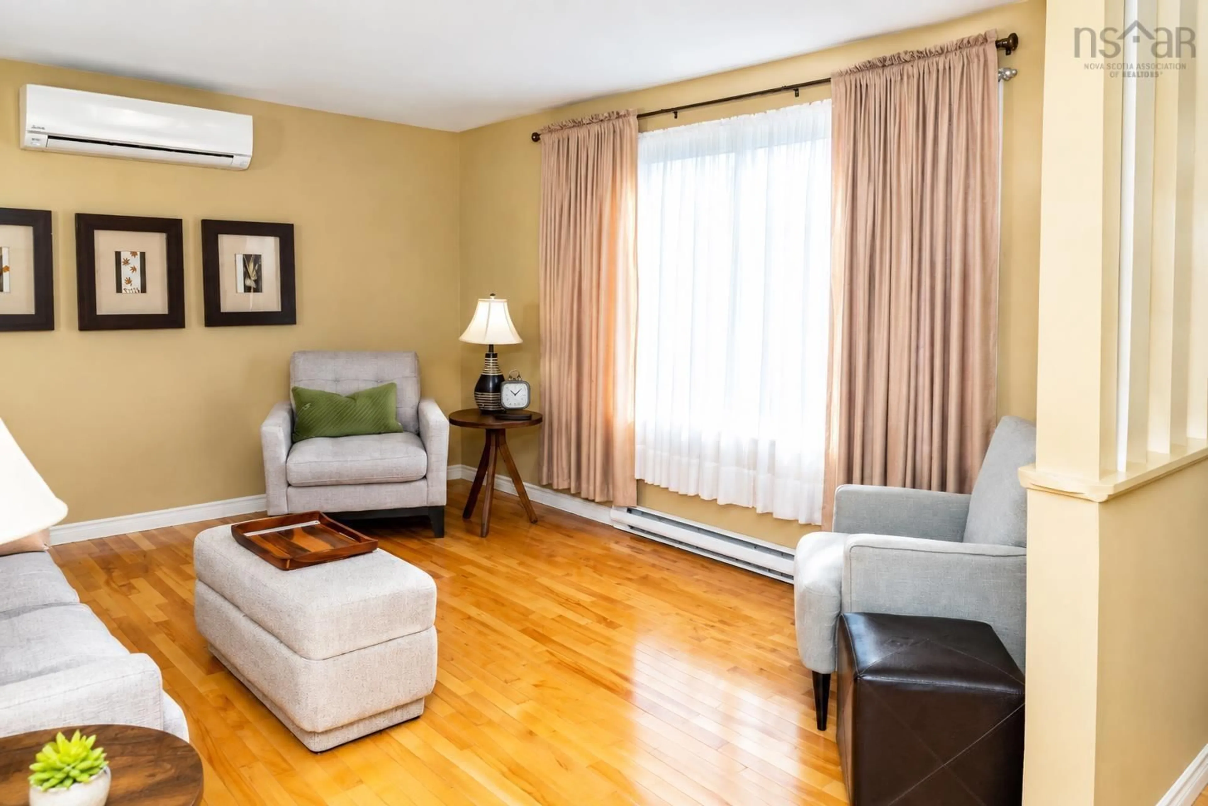 Living room with furniture, wood/laminate floor for 71 Duffell Dr, Sydney Nova Scotia B1P 3G7