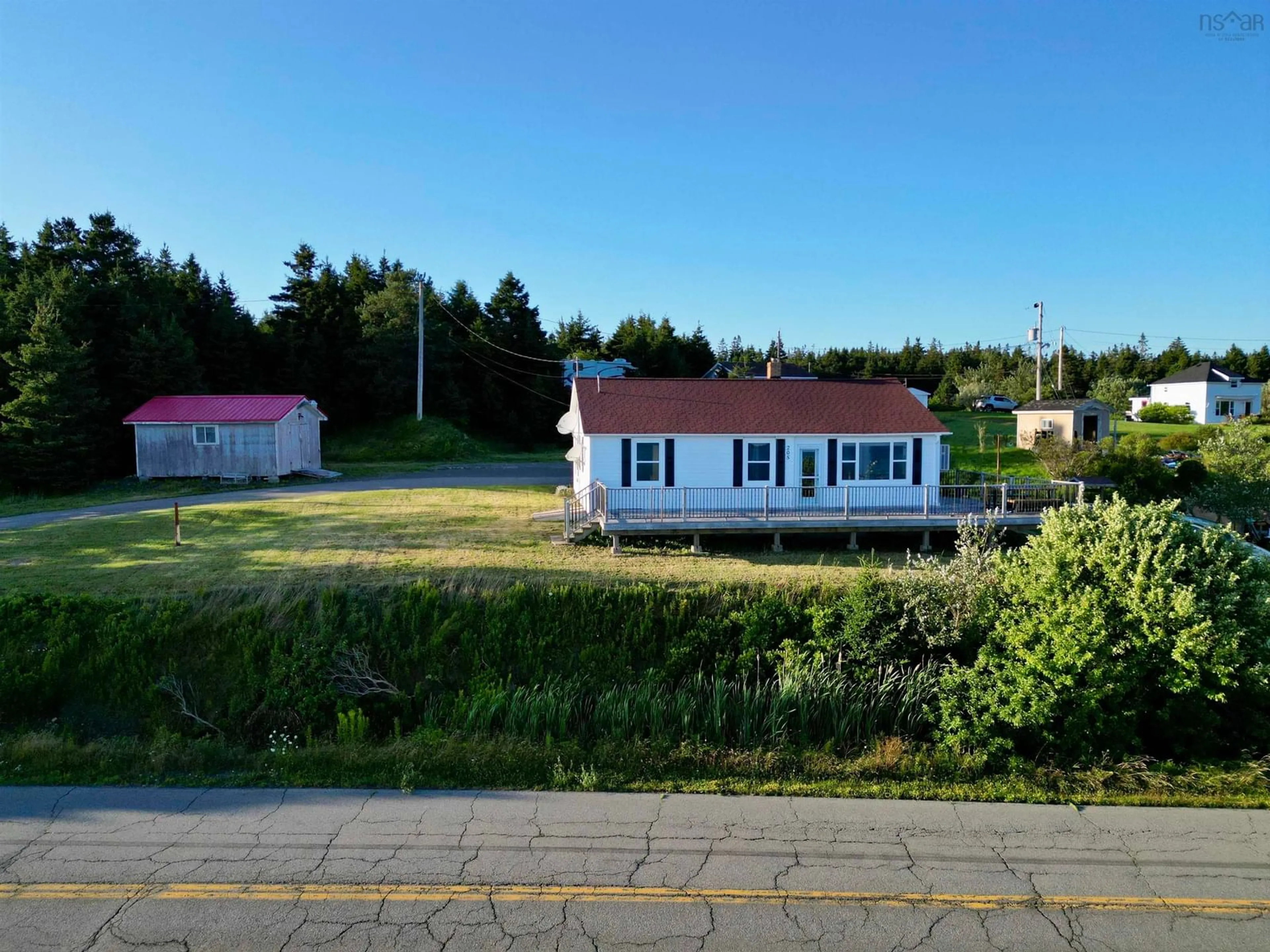 A pic from outside/outdoor area/front of a property/back of a property/a pic from drone, unknown for 205 Veterans Memorial Dr., Arichat Nova Scotia B0E 1A0