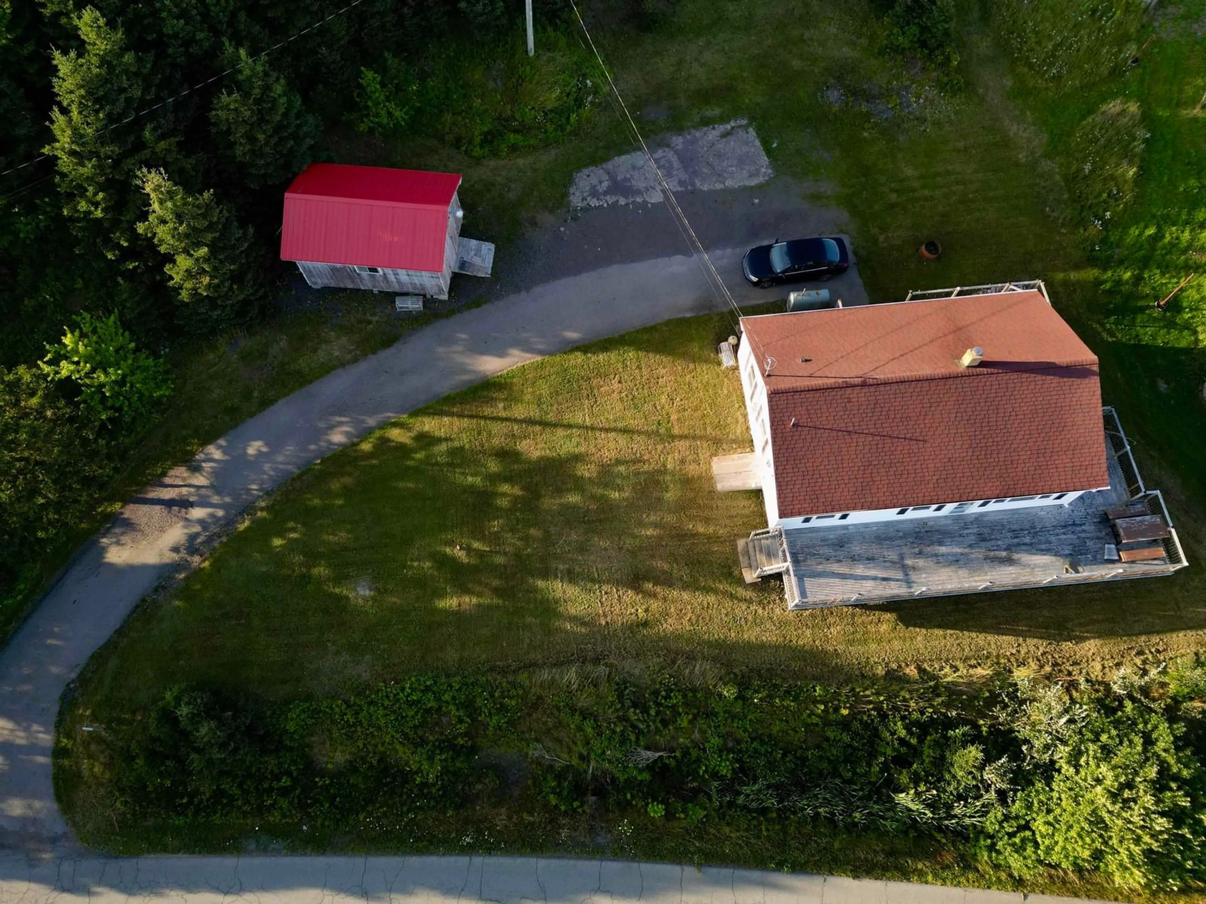A pic from outside/outdoor area/front of a property/back of a property/a pic from drone, street for 205 Veterans Memorial Dr., Arichat Nova Scotia B0E 1A0