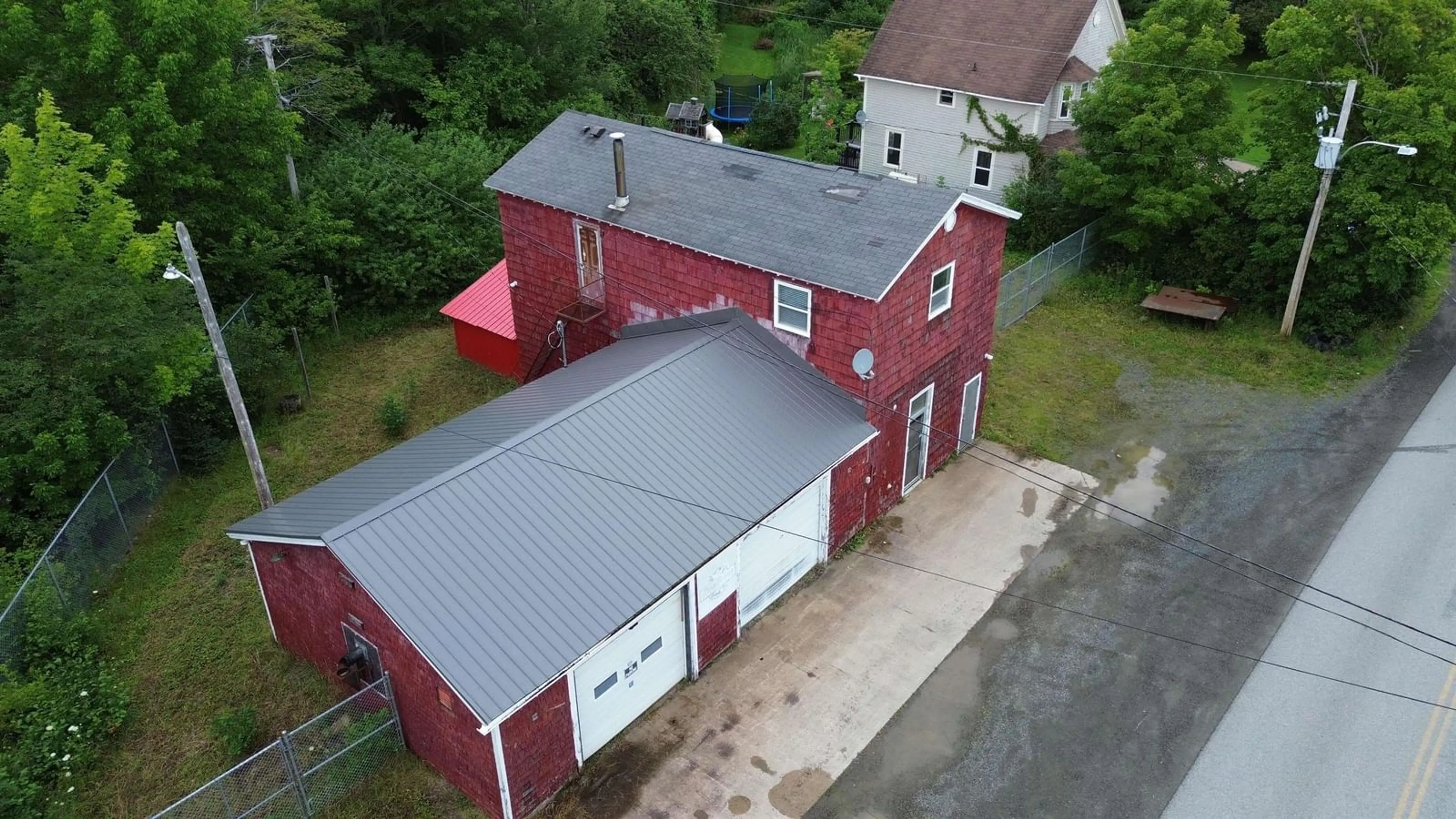 A pic from outside/outdoor area/front of a property/back of a property/a pic from drone, building for 109 Main Street, Whycocomagh Nova Scotia B0E 3M0