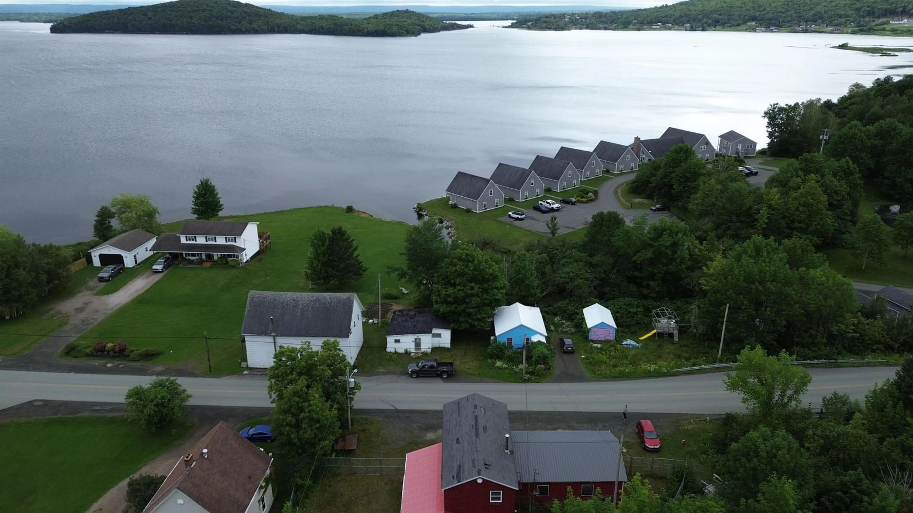 A pic from outside/outdoor area/front of a property/back of a property/a pic from drone, water/lake/river/ocean view for 109 Main Street, Whycocomagh Nova Scotia B0E 3M0
