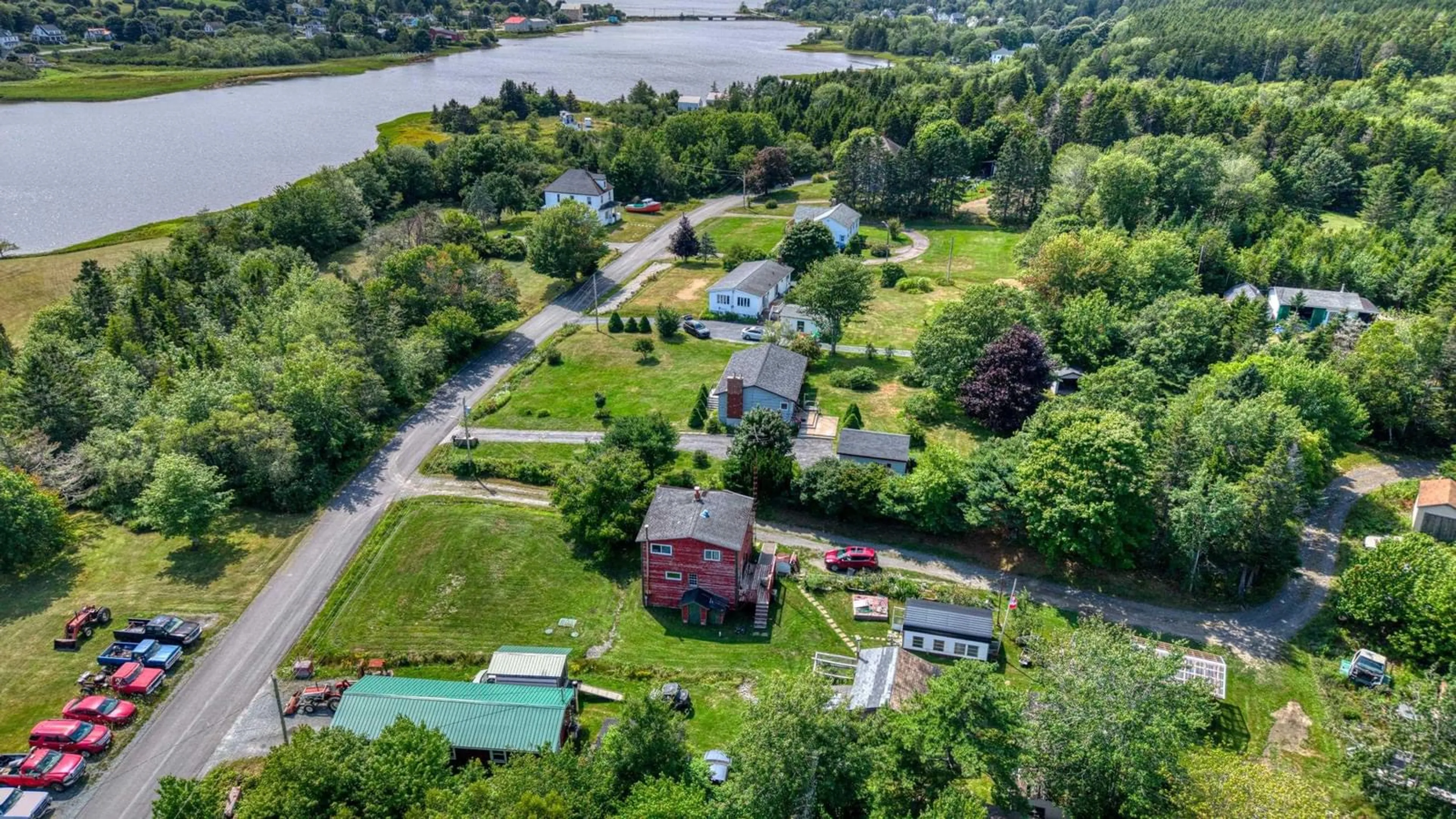 A pic from outside/outdoor area/front of a property/back of a property/a pic from drone, water/lake/river/ocean view for 56 North Side Rd, Riverport Nova Scotia B0J 2W0