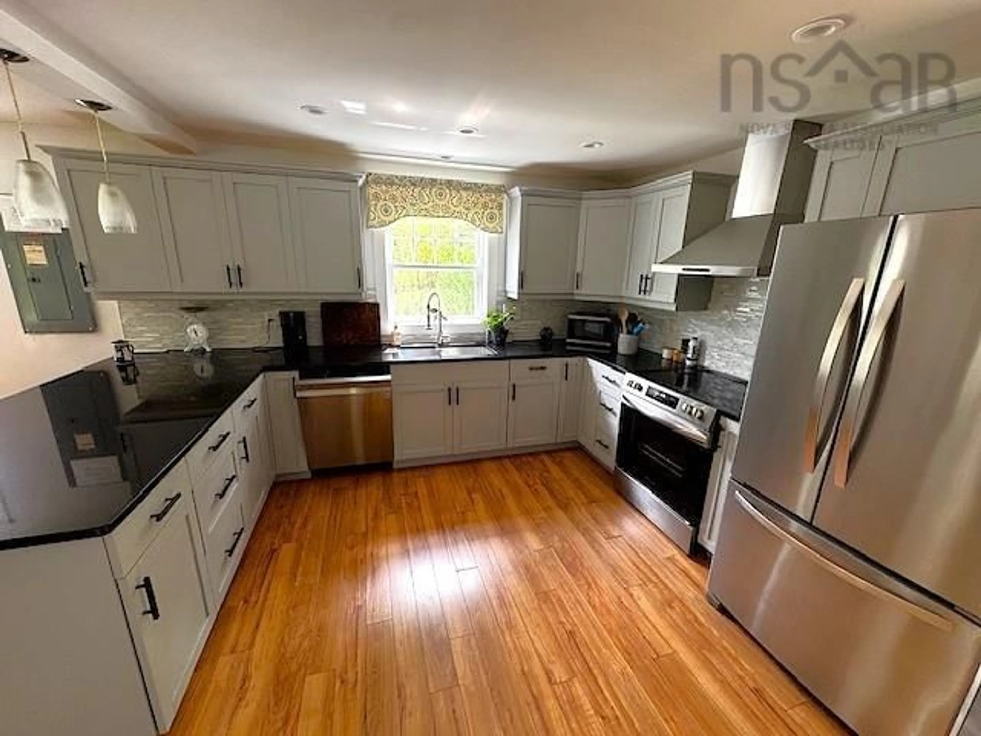 Open concept kitchen, wood/laminate floor for 1543 King St, Bridgewater Nova Scotia B4V 1C4