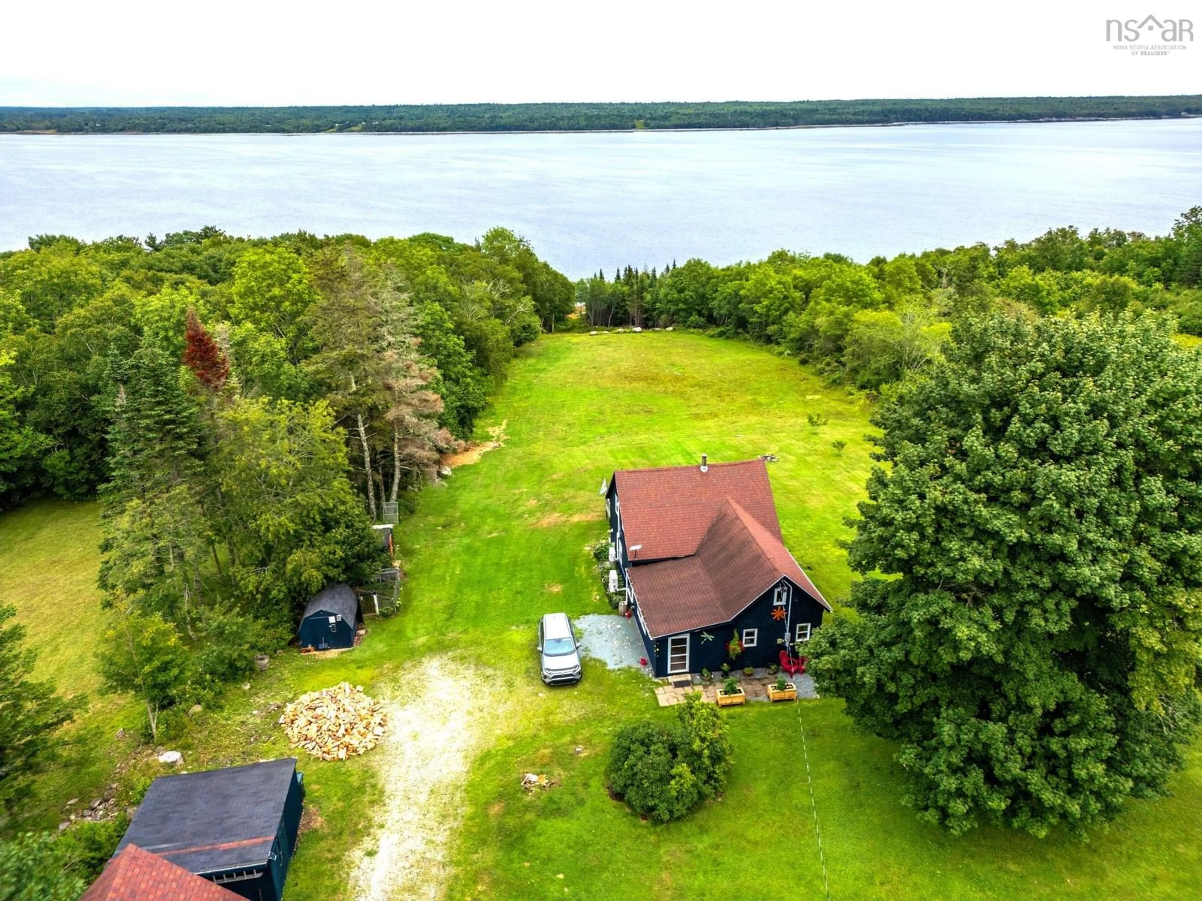 A pic from outside/outdoor area/front of a property/back of a property/a pic from drone, water/lake/river/ocean view for 5100 Sandy Point Rd, Jordan Ferry Nova Scotia B0T 1W0