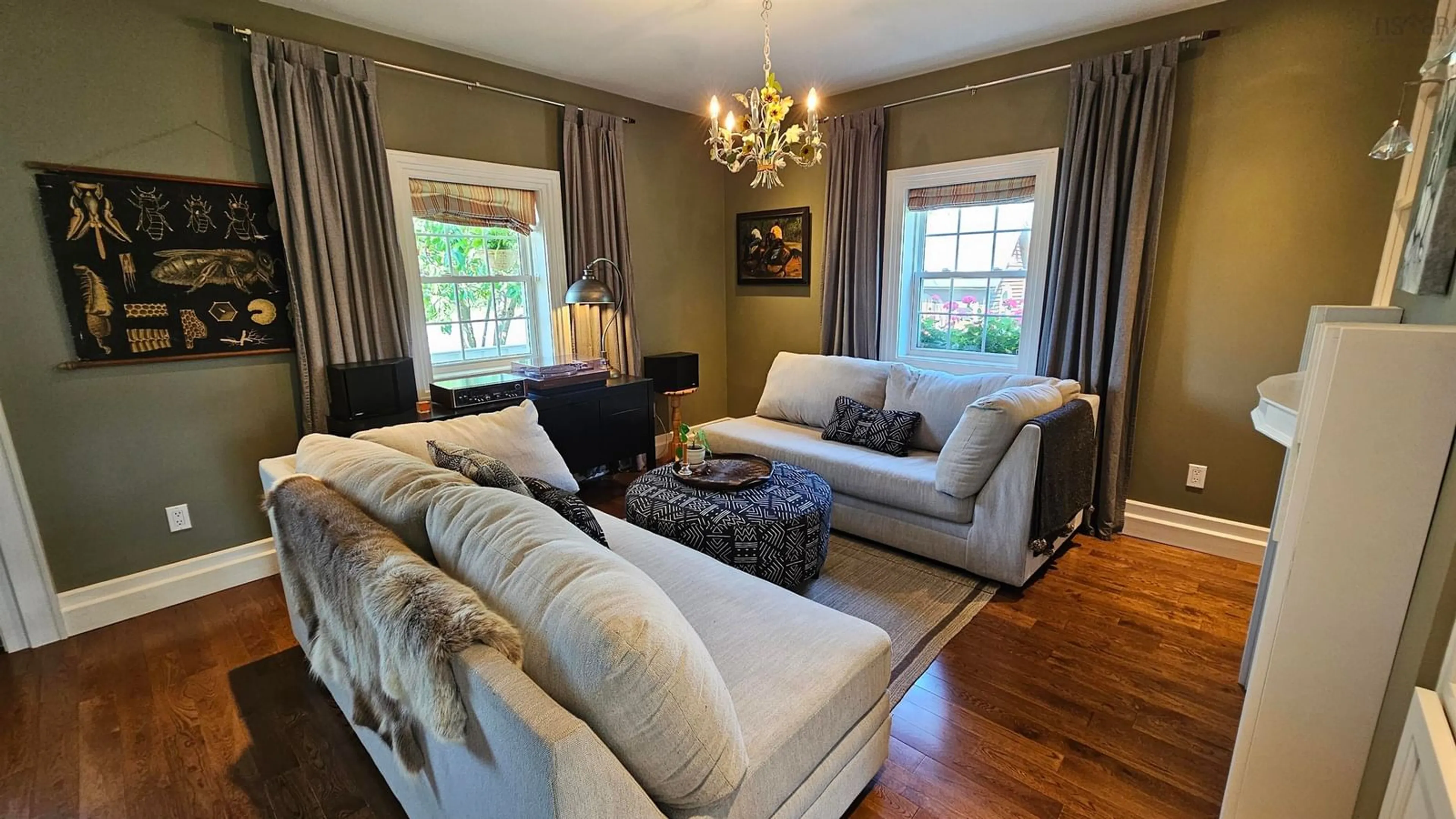Living room with furniture, wood/laminate floor for 6896 Highway 2, Portapique Nova Scotia B0M 1B0