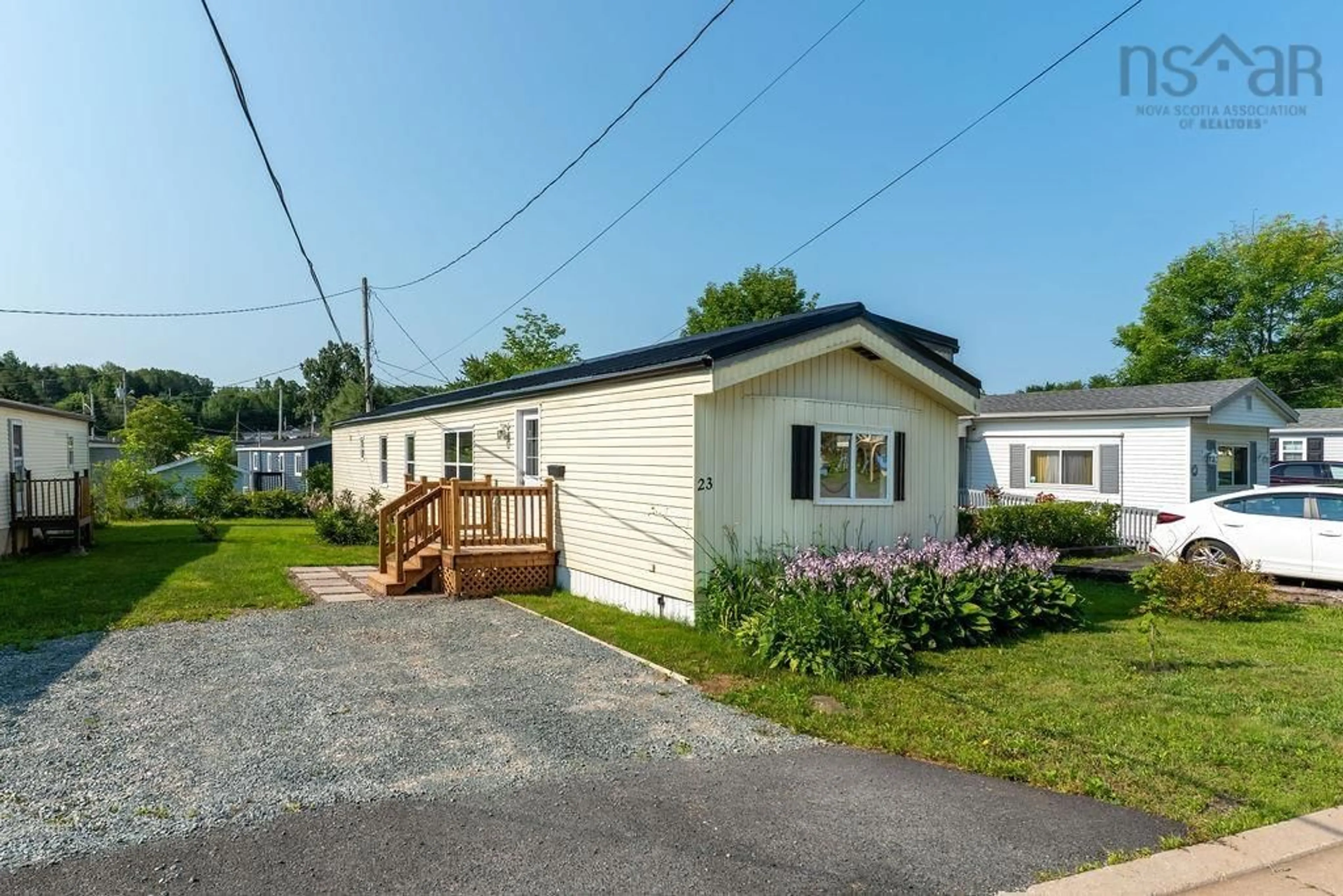 Home with vinyl exterior material, street for 23 Brook St, Middle Sackville Nova Scotia B4E 1B7