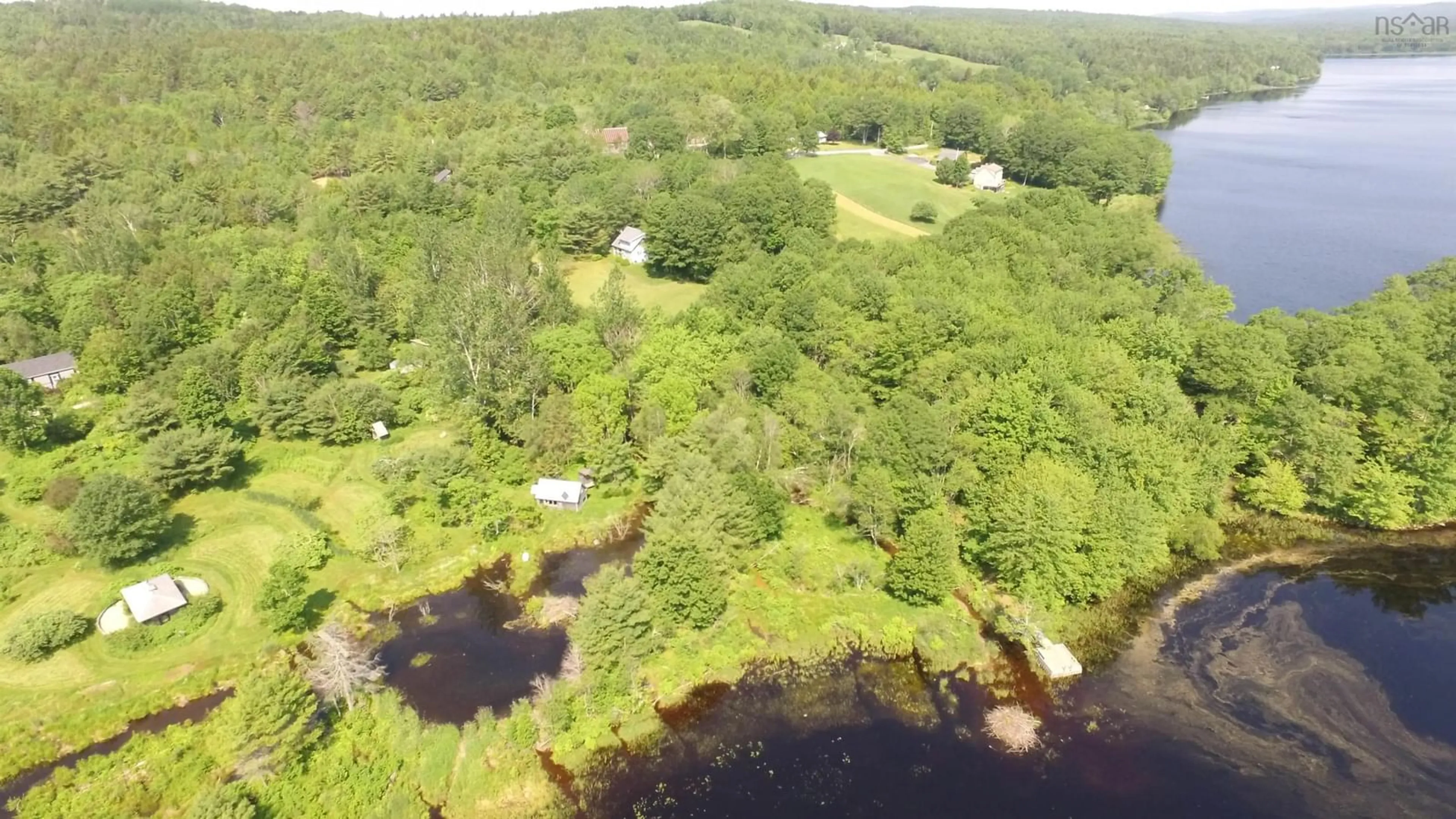 A pic from outside/outdoor area/front of a property/back of a property/a pic from drone, water/lake/river/ocean view for 63 Frank Rd, Italy Cross Nova Scotia B4V 0N3