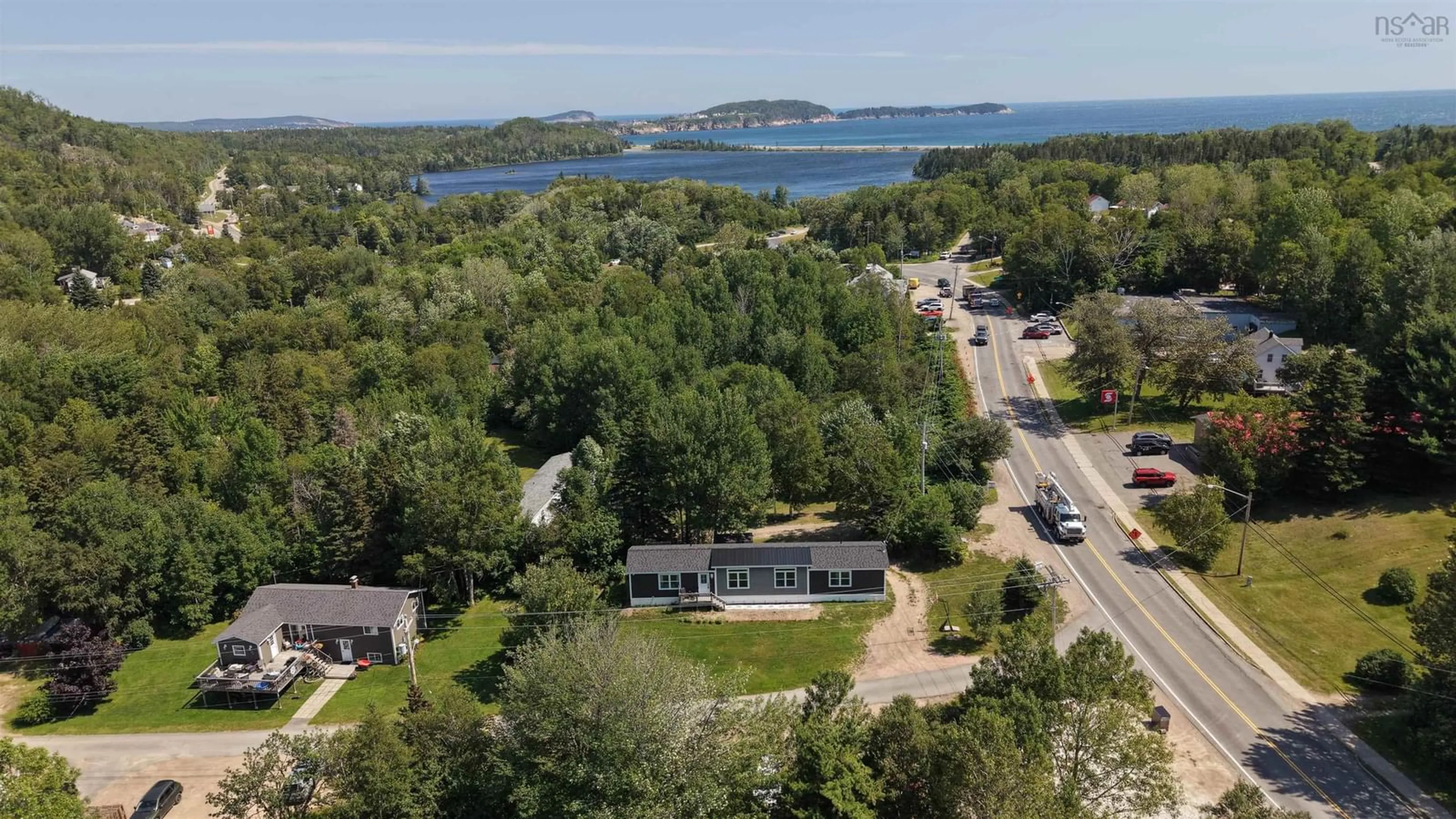 A pic from outside/outdoor area/front of a property/back of a property/a pic from drone, water/lake/river/ocean view for 4 Kellys Lane, Ingonish Nova Scotia B0C 1L0