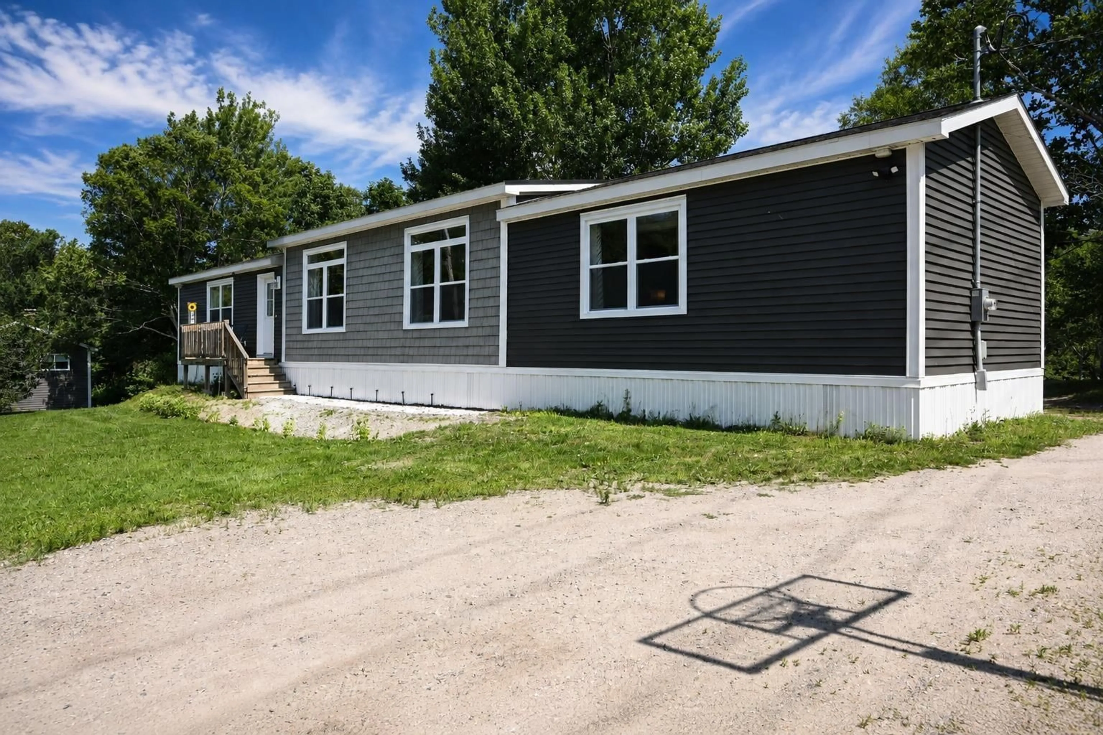 Home with vinyl exterior material, street for 4 Kellys Lane, Ingonish Nova Scotia B0C 1L0