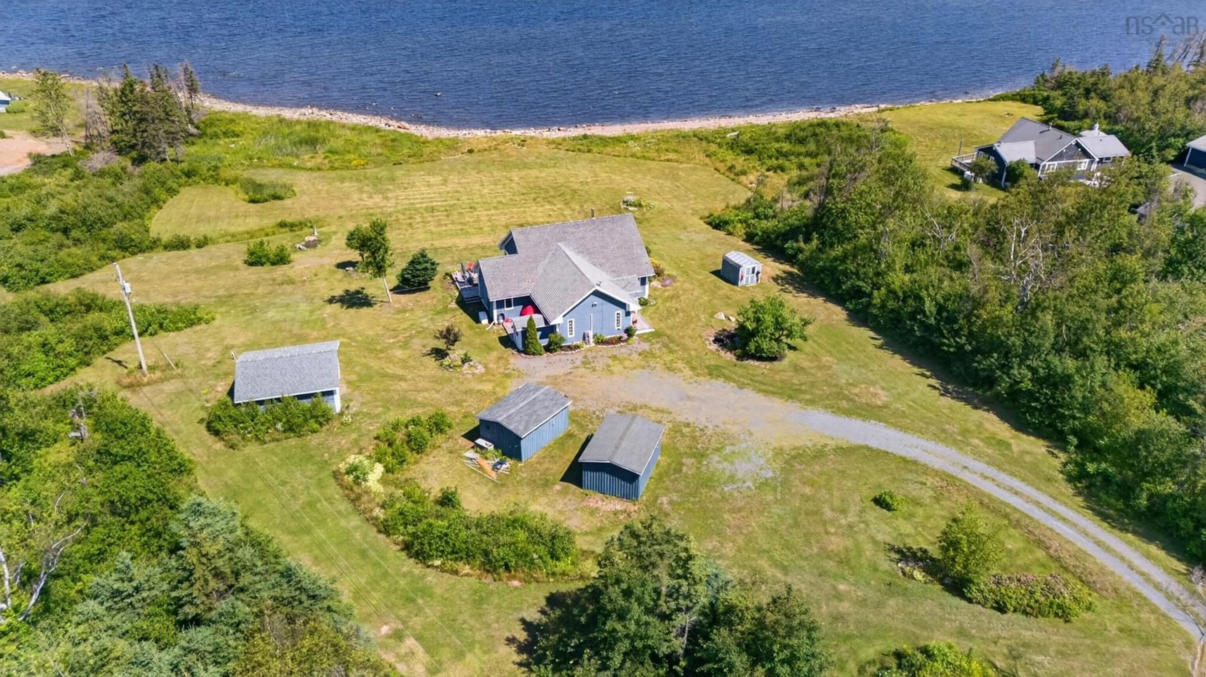 A pic from outside/outdoor area/front of a property/back of a property/a pic from drone, water/lake/river/ocean view for 969 Blue Sea Rd, Malagash Point Nova Scotia B0K 1E0