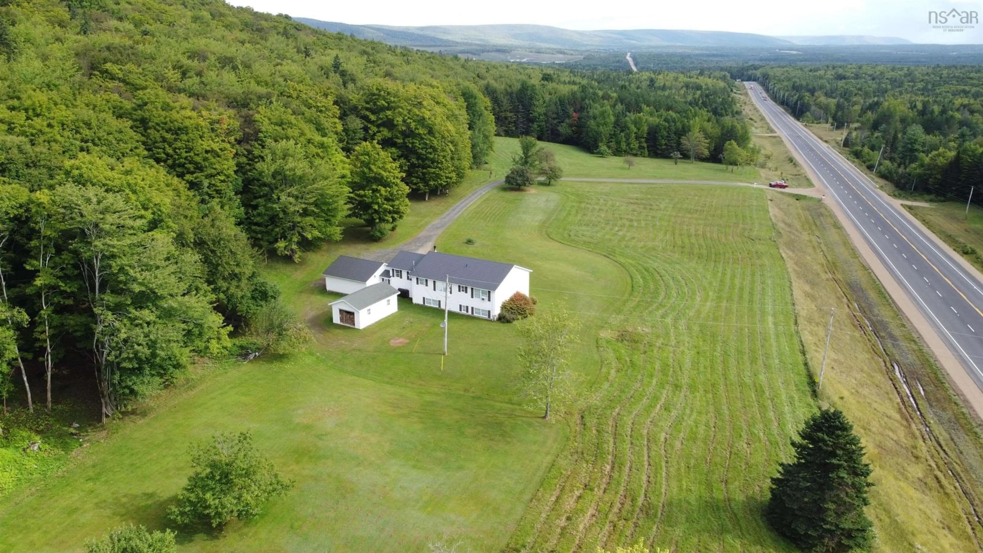 A pic from outside/outdoor area/front of a property/back of a property/a pic from drone, mountain view for 5679 Highway 105 Hwy, Melford Nova Scotia B0E 2Y0