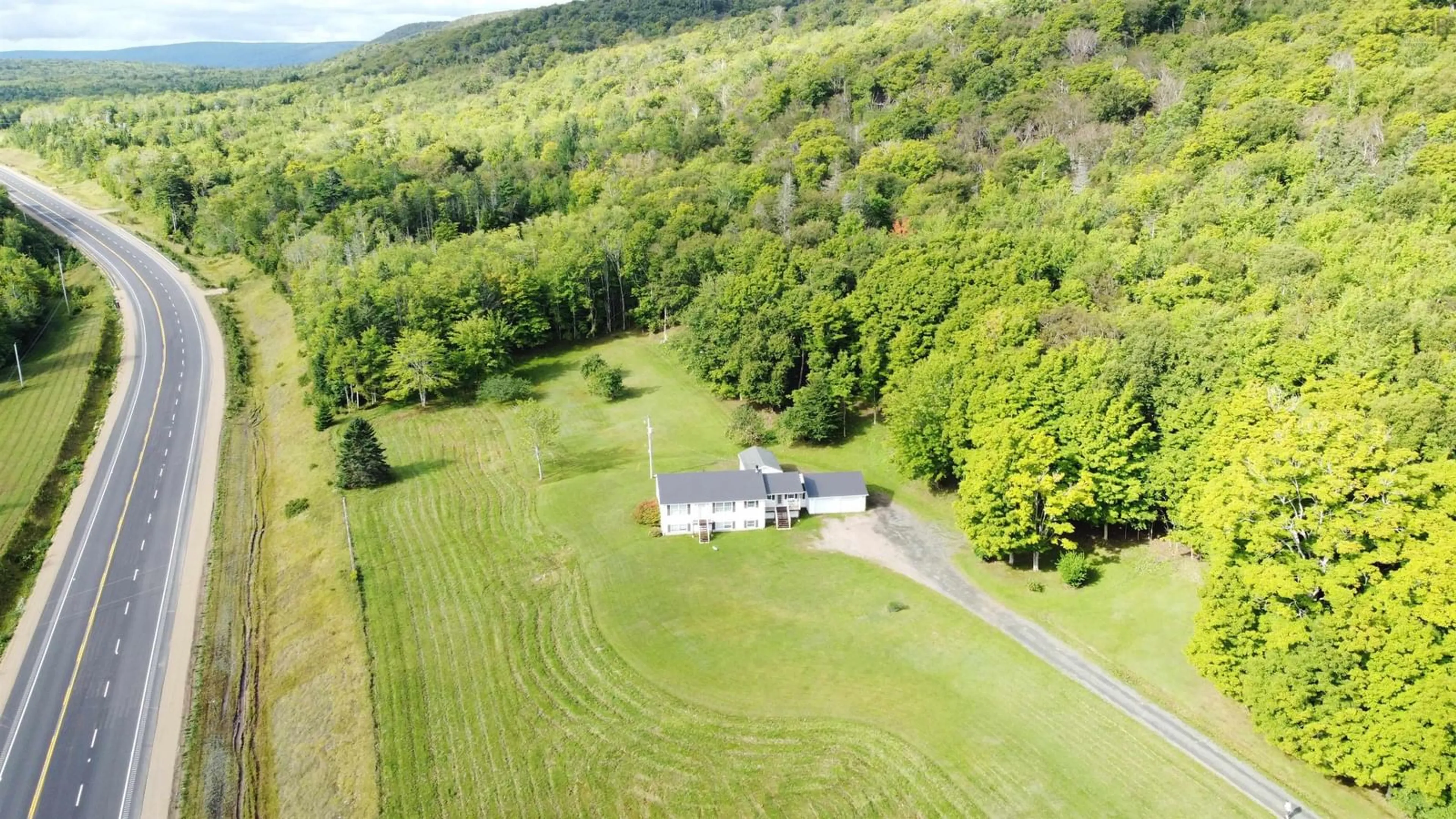 A pic from outside/outdoor area/front of a property/back of a property/a pic from drone, unknown for 5679 Highway 105 Hwy, Melford Nova Scotia B0E 2Y0