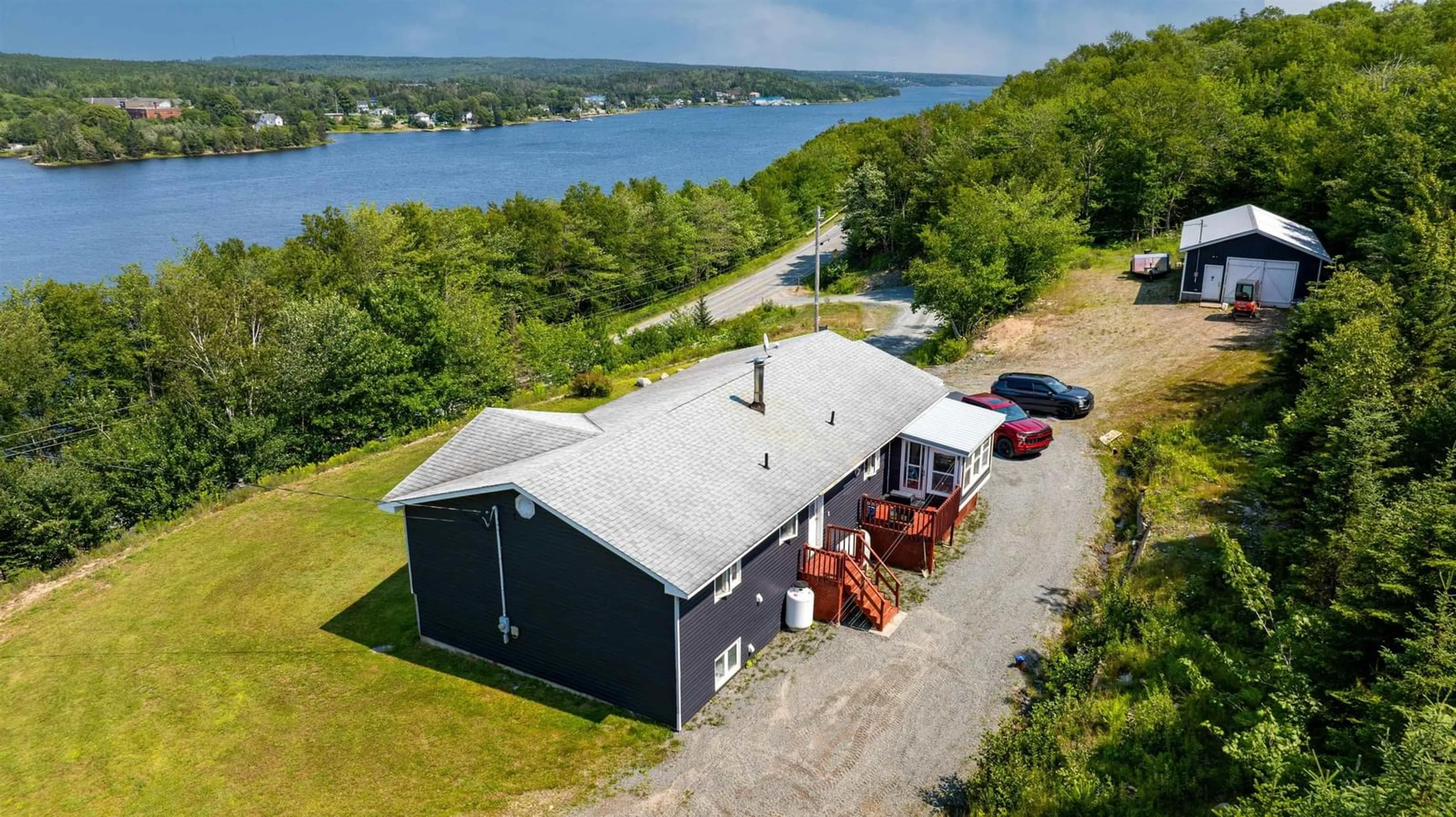 A pic from outside/outdoor area/front of a property/back of a property/a pic from drone, water/lake/river/ocean view for 22163 Highway 7, Sheet Harbour Nova Scotia B0J 3B0