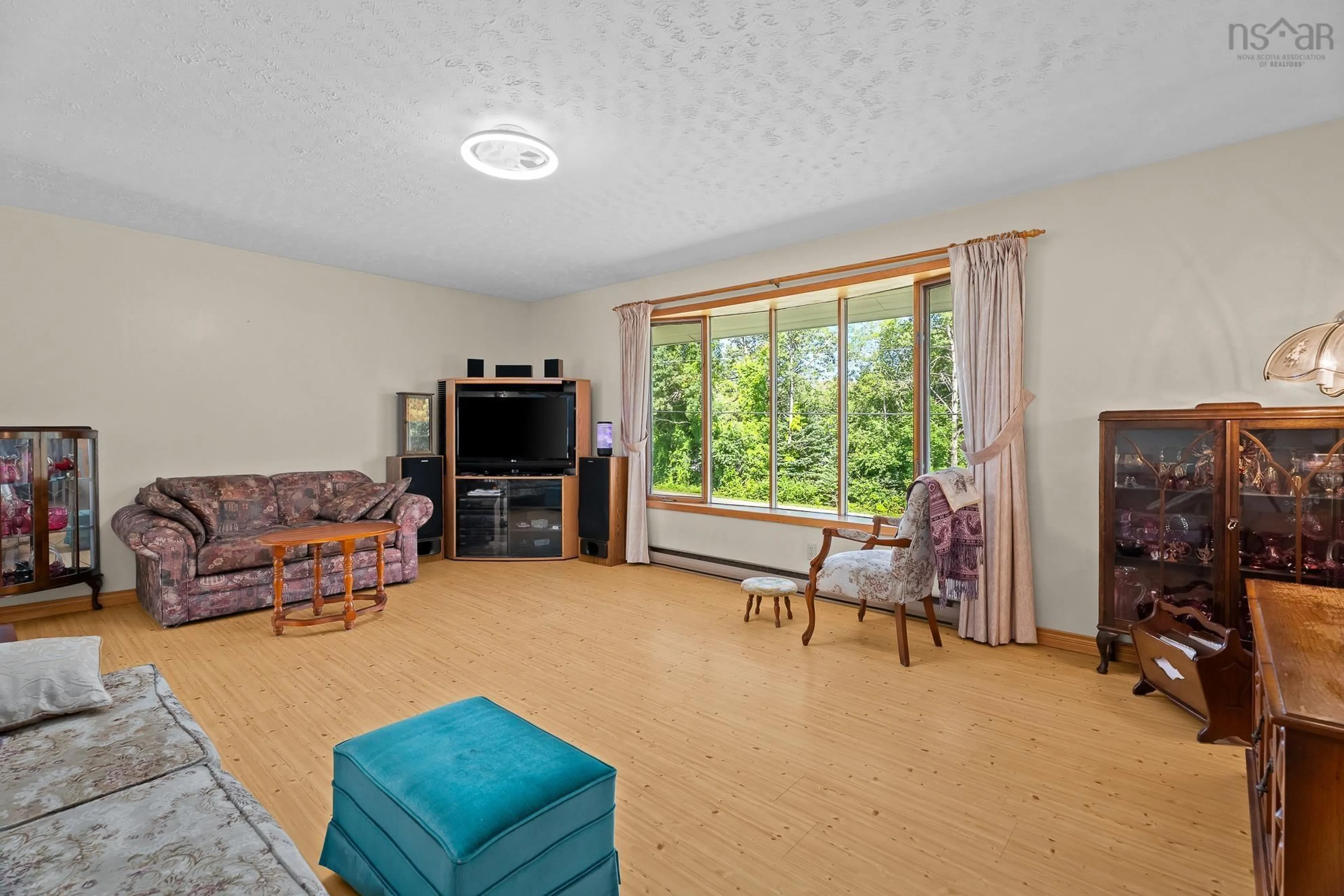 Living room with furniture, unknown for 128 Middle River Road, Marriotts Cove Nova Scotia B0J 1K0