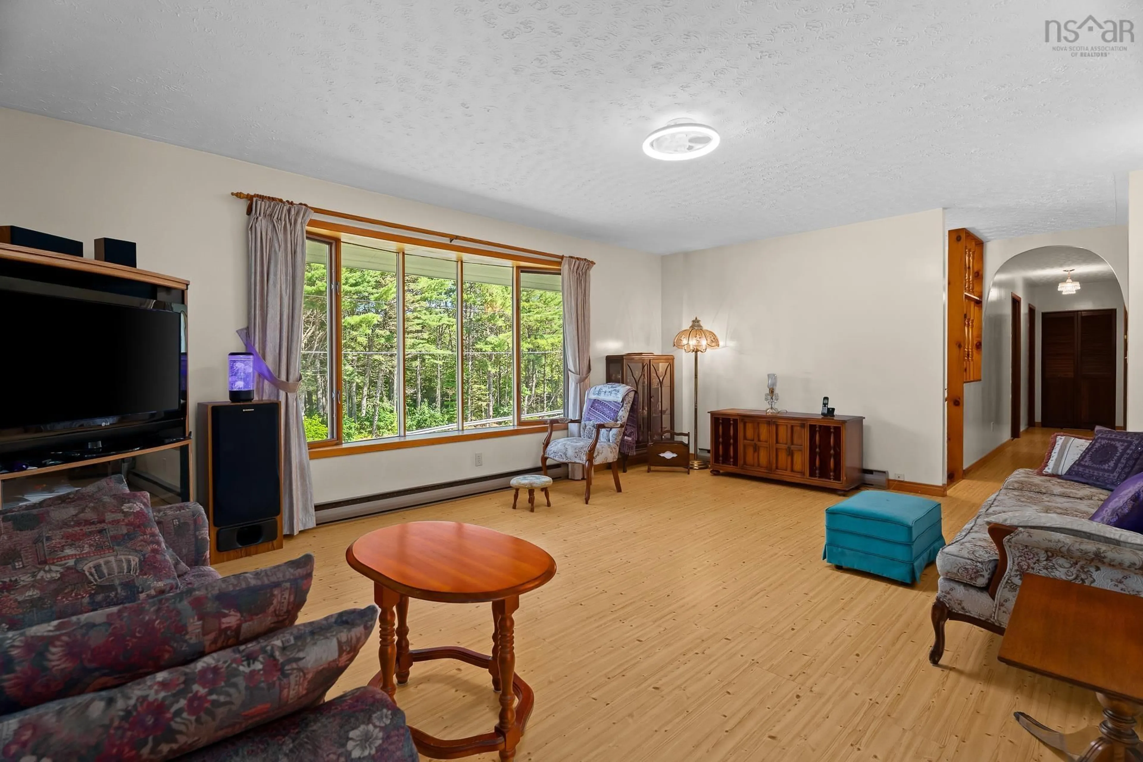 Living room with furniture, unknown for 128 Middle River Road, Marriotts Cove Nova Scotia B0J 1K0