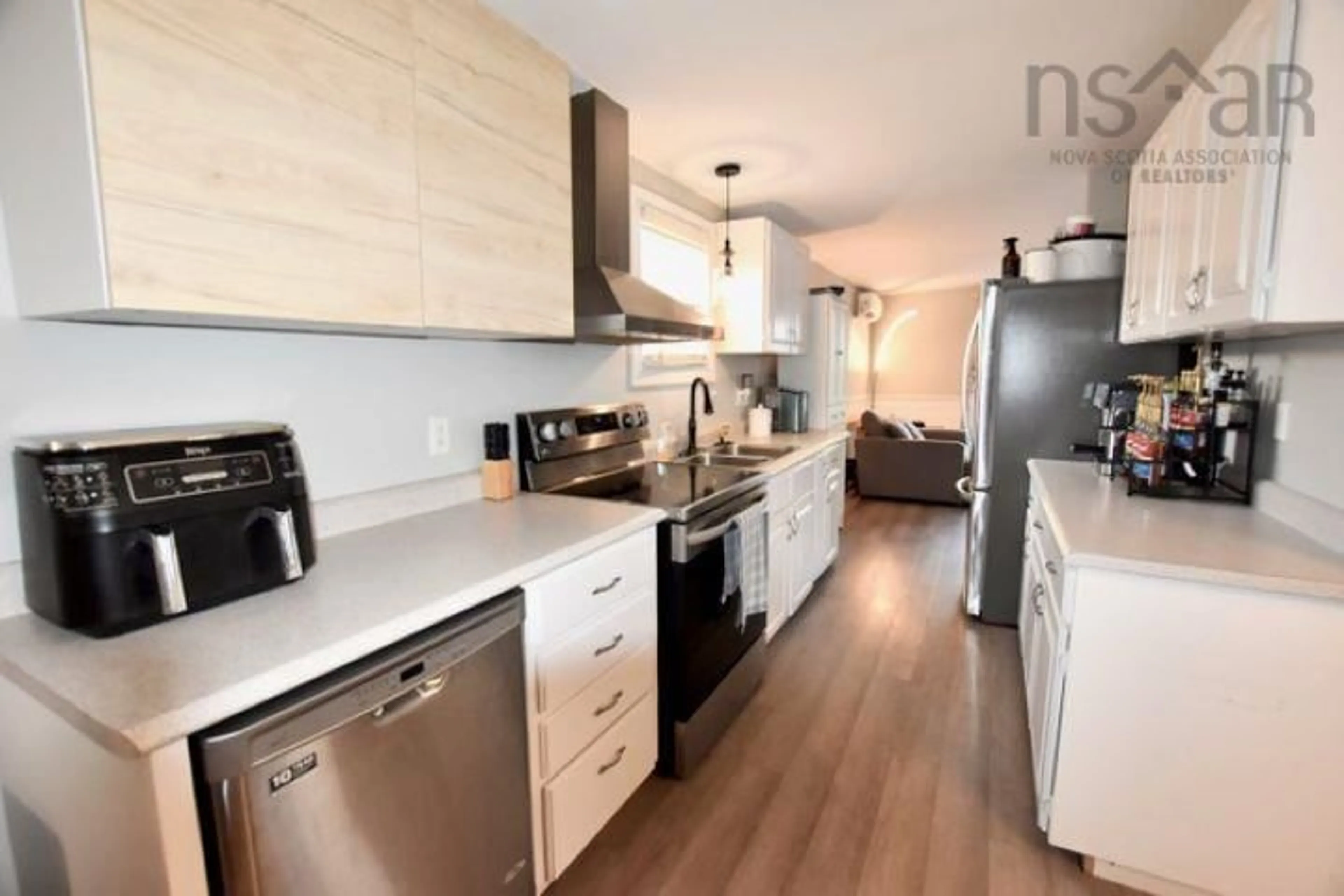 Open concept kitchen, wood/laminate floor for 1647 Frankie Dr, Beaver Bank Nova Scotia B4E 2N1