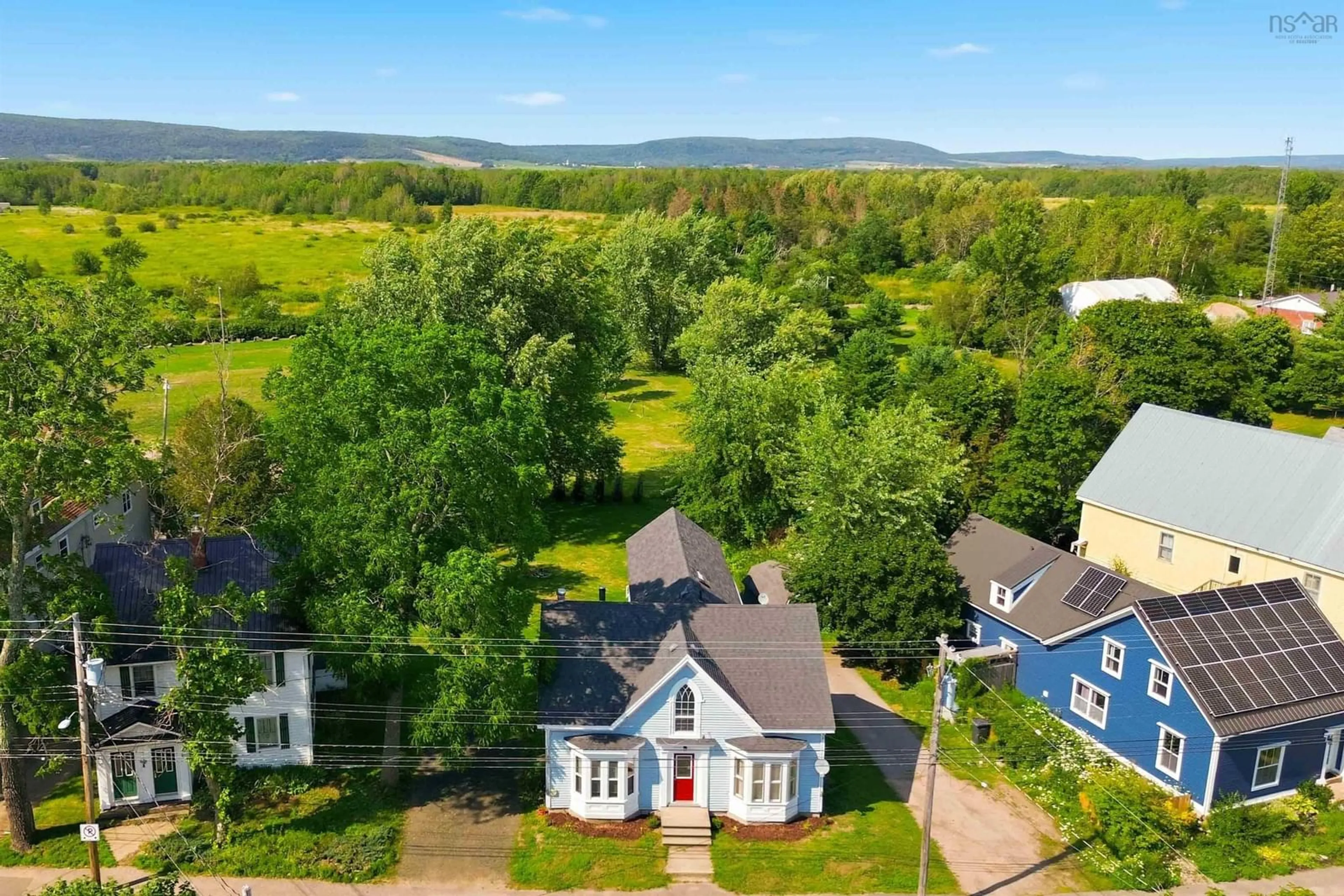 A pic from outside/outdoor area/front of a property/back of a property/a pic from drone, unknown for 525 Main St, Lawrencetown Nova Scotia B0S 1M0